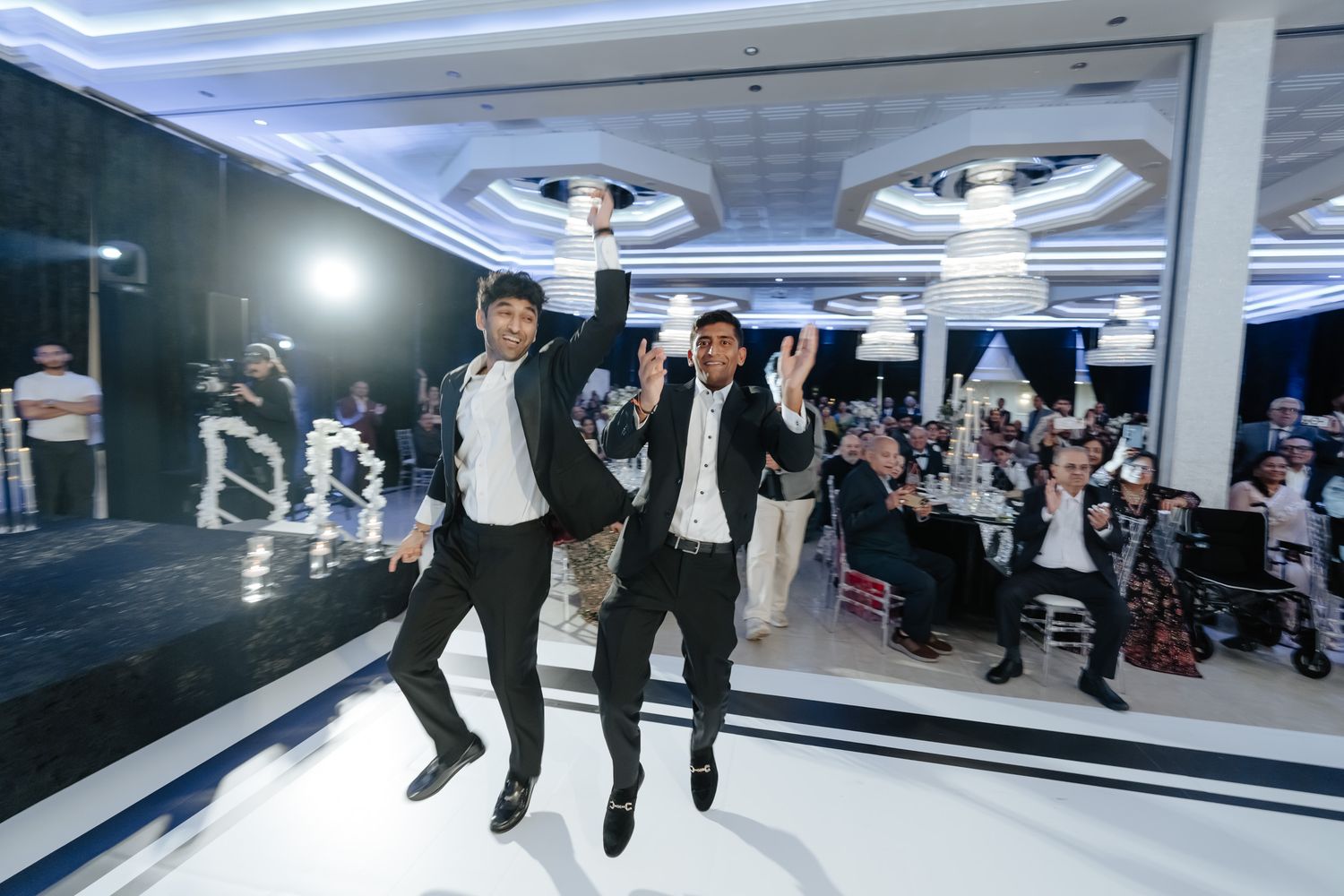 Creative panoramic photo sequence showing people jumping and dancing at an indoor venue.