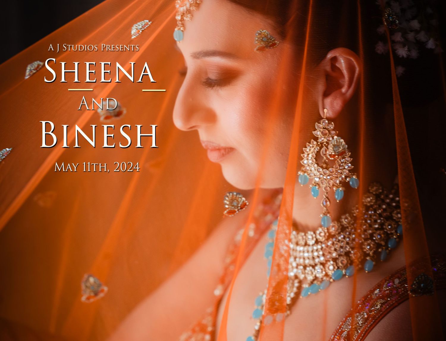 A bride in traditional Indian wedding attire with ornate jewelry glows in warm orange lighting during her wedding preparations.