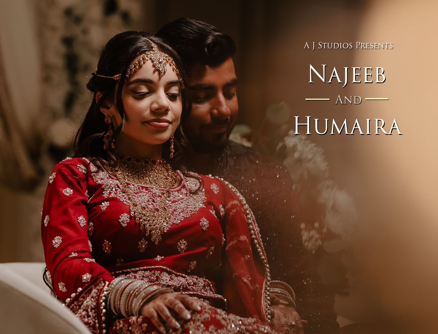 A bride in a traditional red lehenga shows her intricate henna designs and jewelry during a South Asian wedding celebration.
