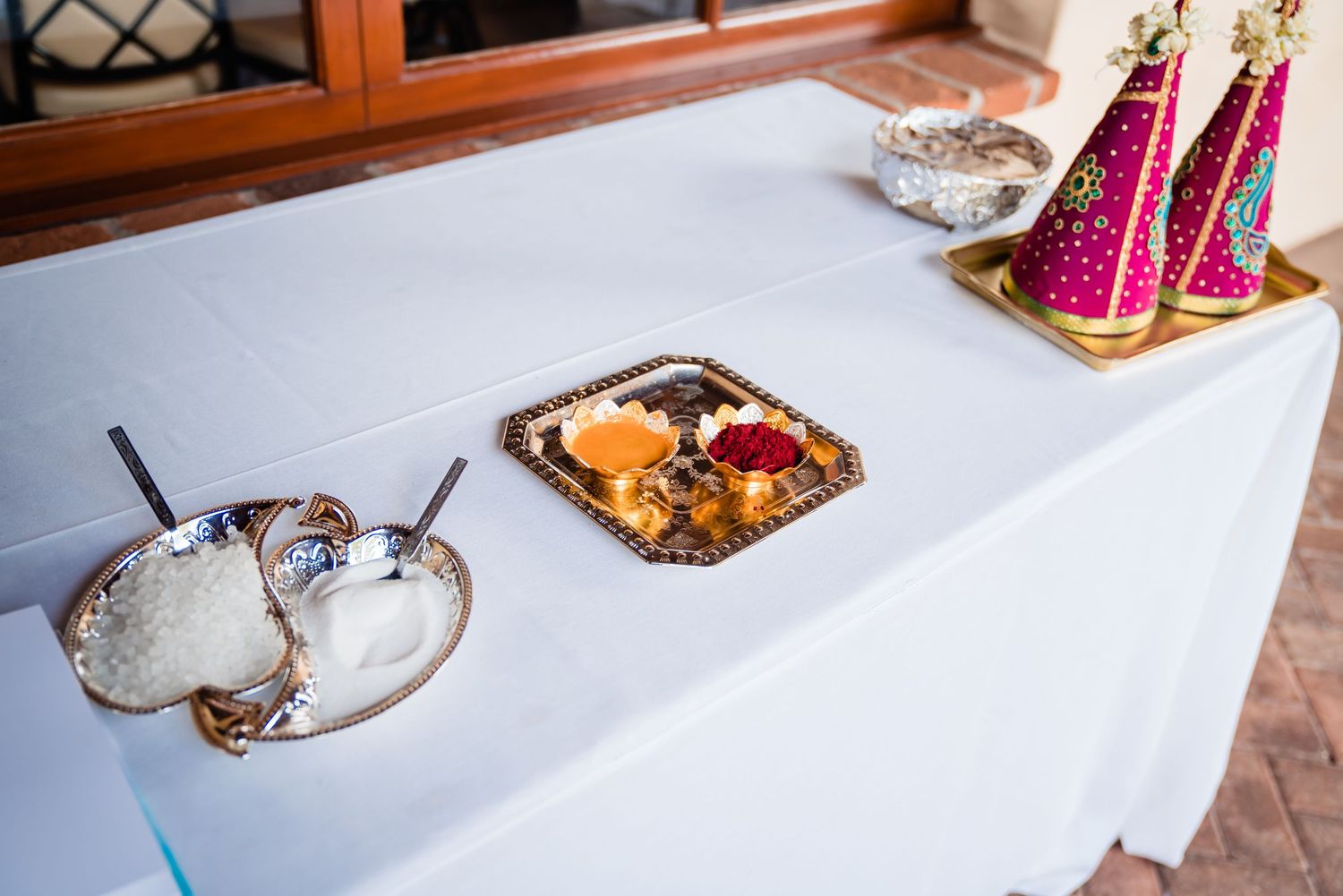 A sequence of overhead shots showing toast being prepared with various toppings and ingredients on a white surface.