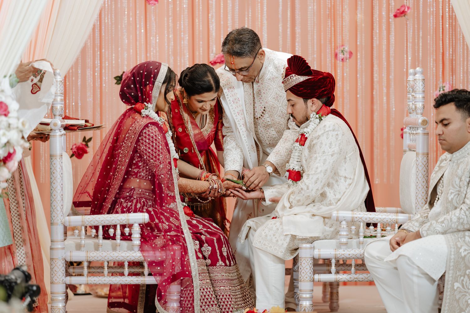 Wedding ceremony sequence showing cultural rituals with rose petals and traditional Indian decorations.