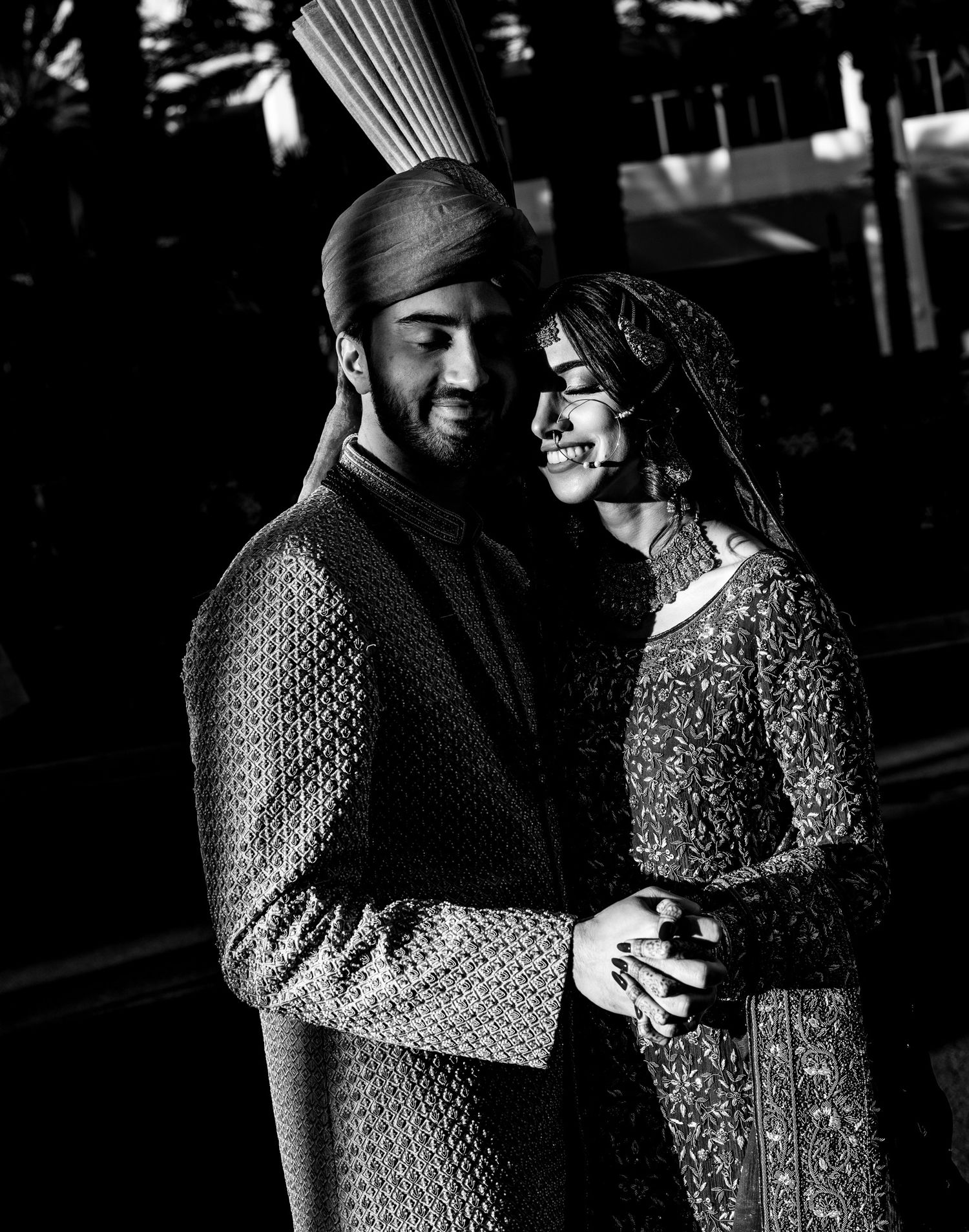 Romantic black and white photo series of a couple dancing together in intimate moments.