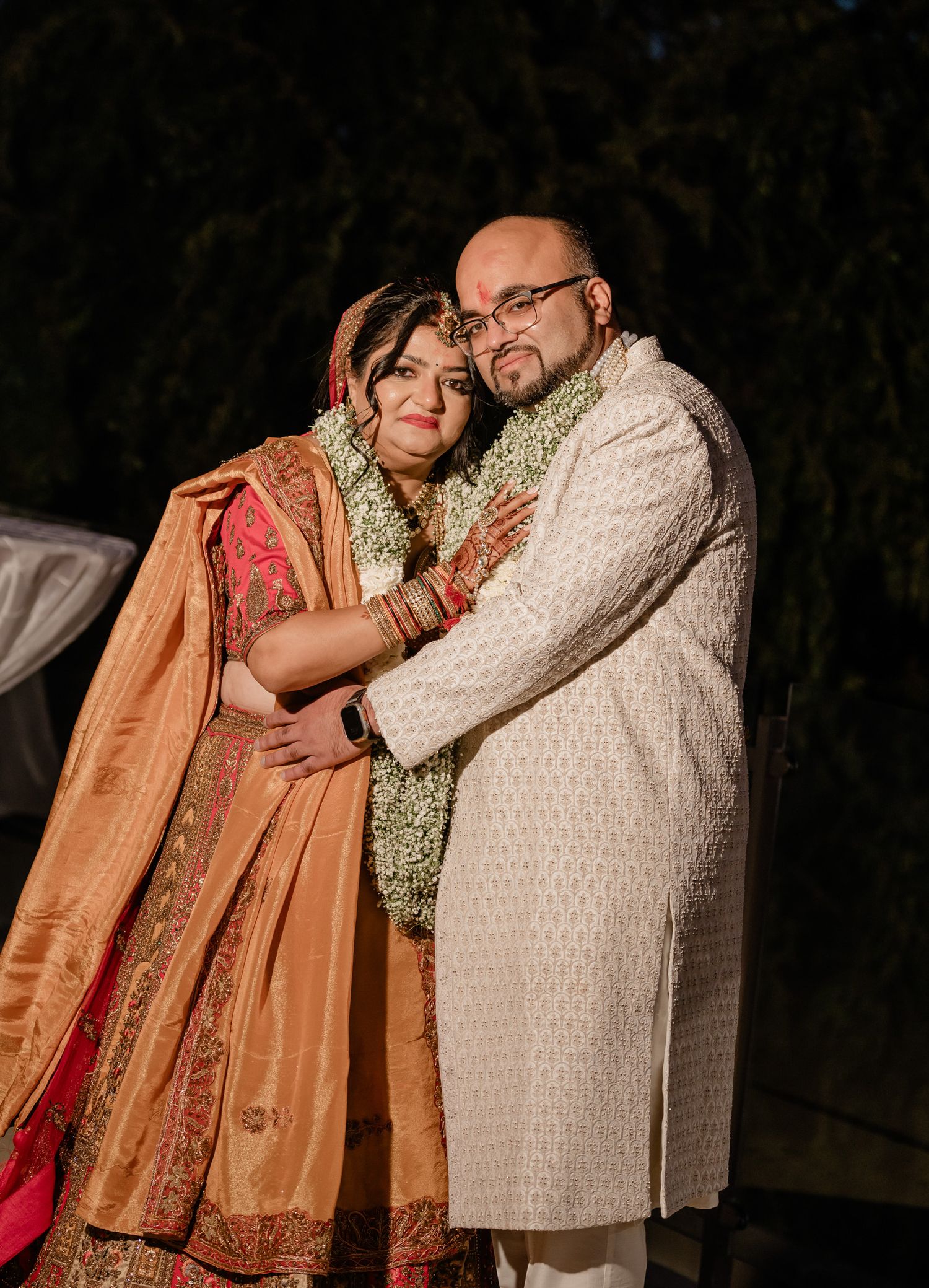 A series of intimate evening portrait shots showing traditional South Asian wedding attire and jewelry.
