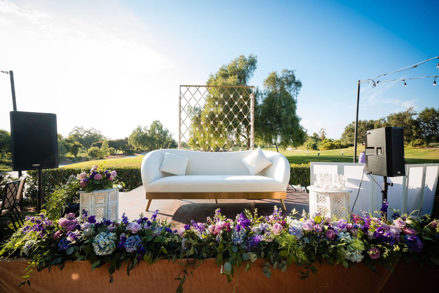 A panoramic sequence of outdoor wedding ceremony venue photos showing white chairs and floral arrangements at sunset.