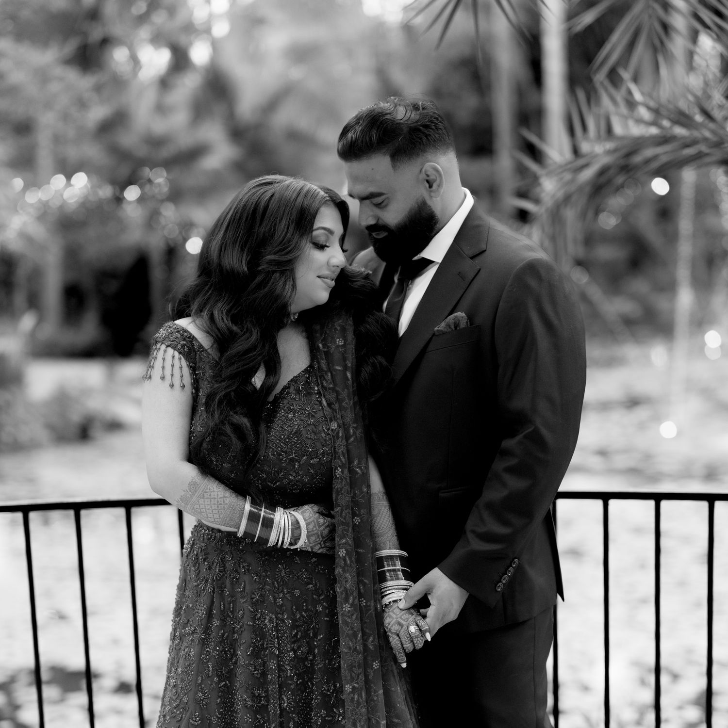 Romantic black and white portrait of couple in formal attire.