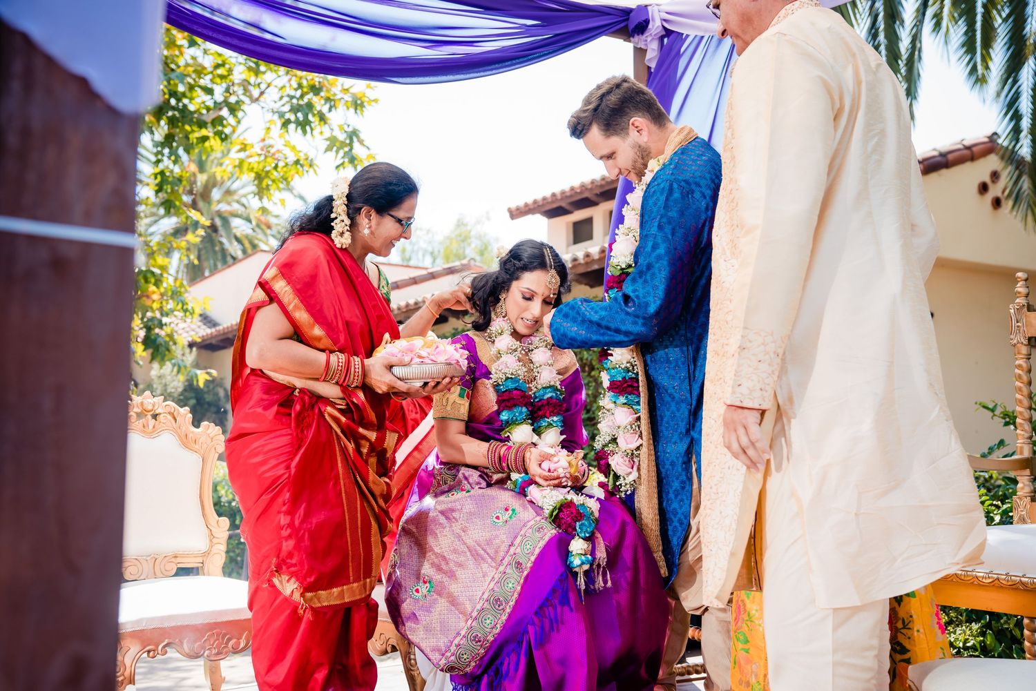 Traditional Indian wedding ceremony with guests exchanging gifts and blessings during a colorful cultural celebration.