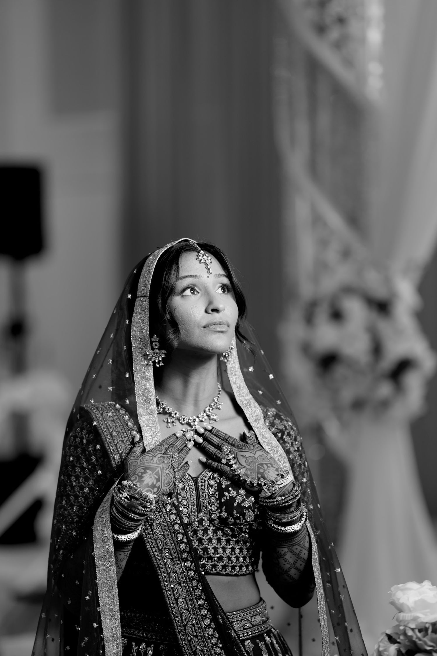Close-up shots of a bride in traditional Indian wedding attire with ornate jewelry and embroidered dress.