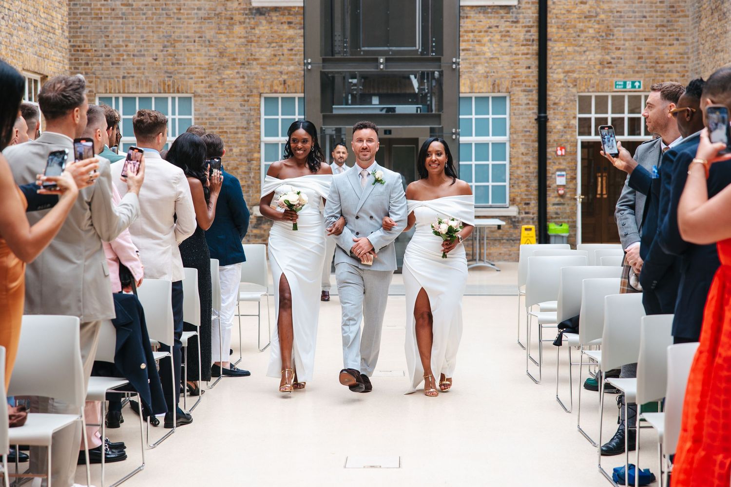 Same-sex wedding ceremony in Hackney Town Hall Atrium Room.