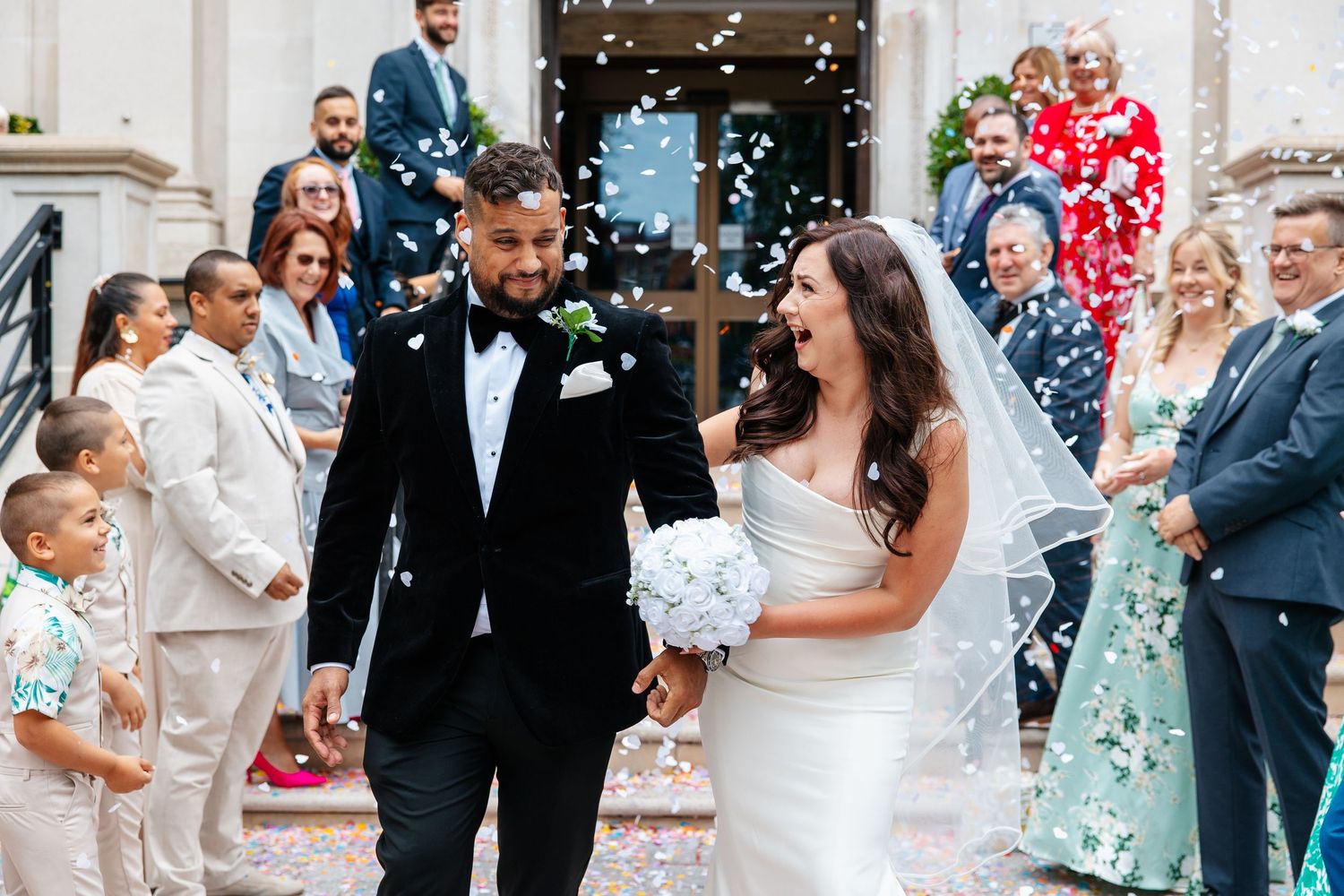 Wedding confetti exit outside London venue