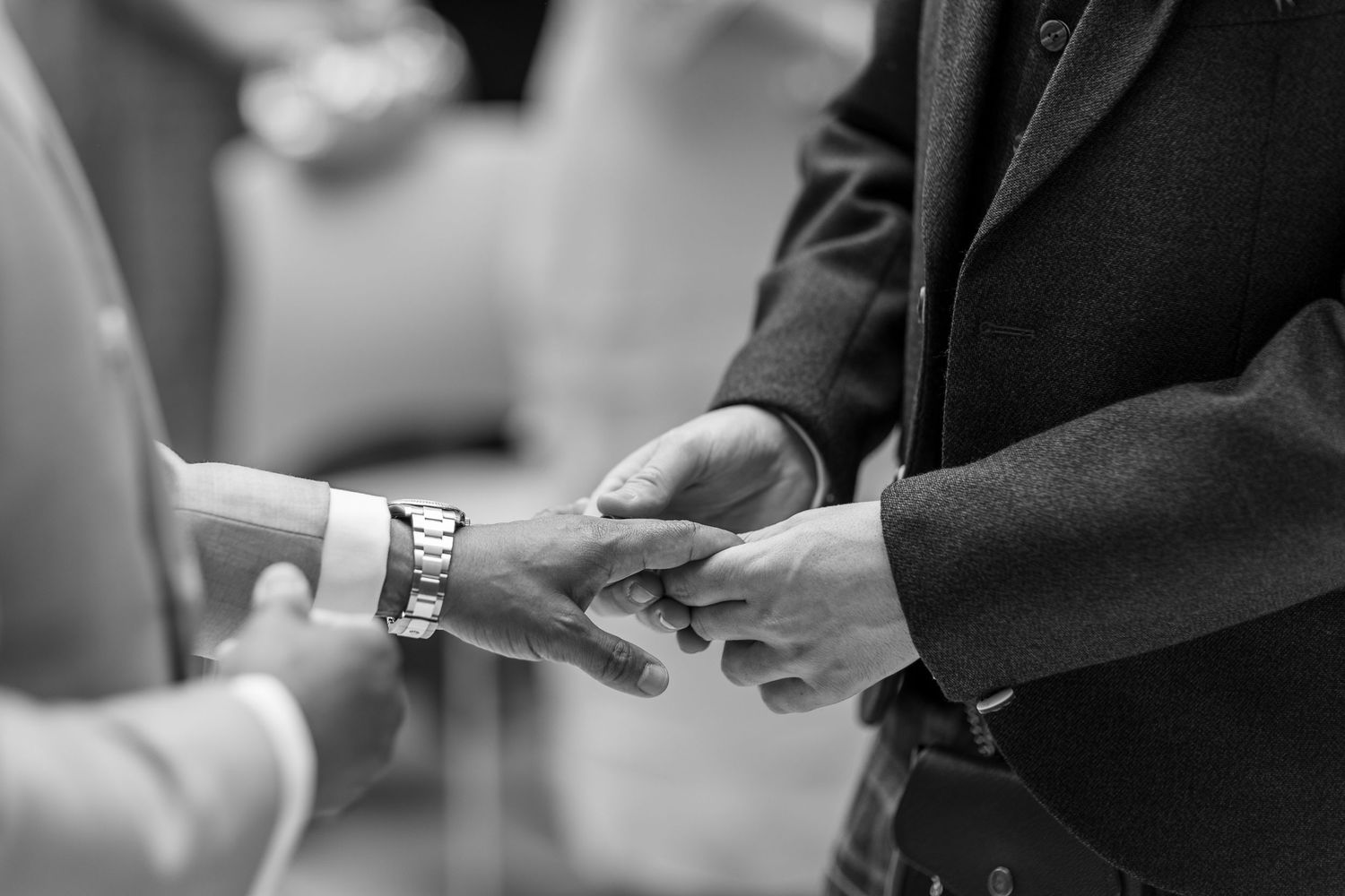Grooms exchanging rings in the Atrium Room, Hackney Town Hall.