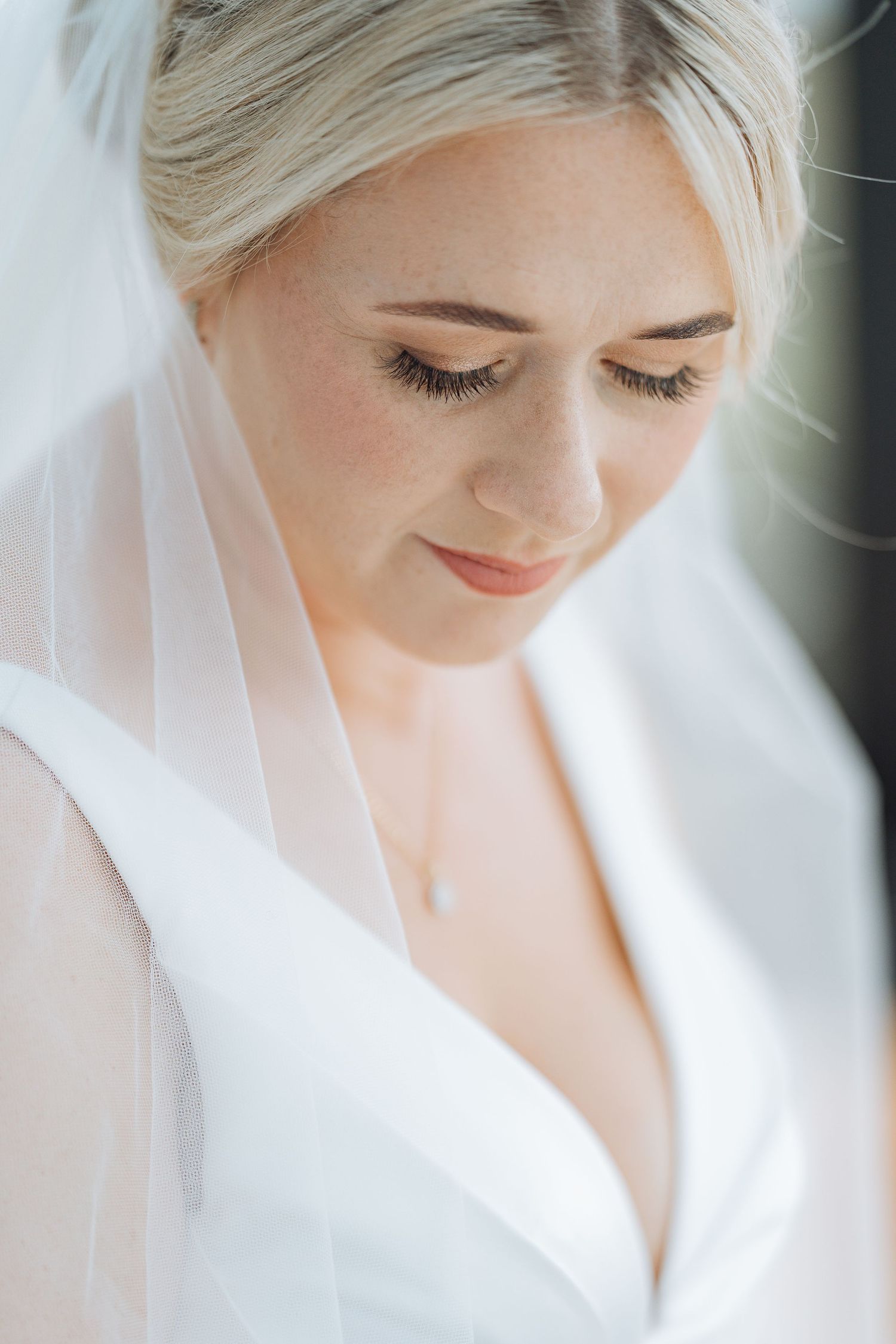 Soft, ethereal bridal portrait with delicate veil details.