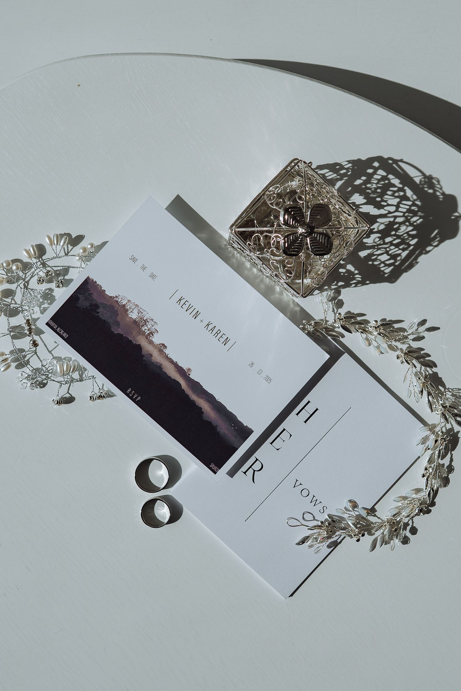 Wedding stationery and invitations arranged artistically in natural light.