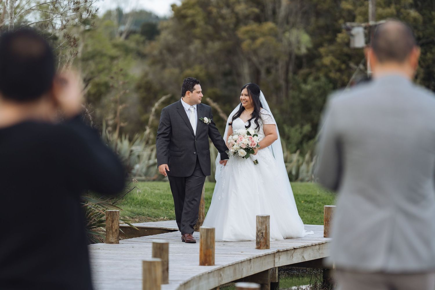 Scenic outdoor wedding ceremony setup with guests seated on a beautiful sunny day.