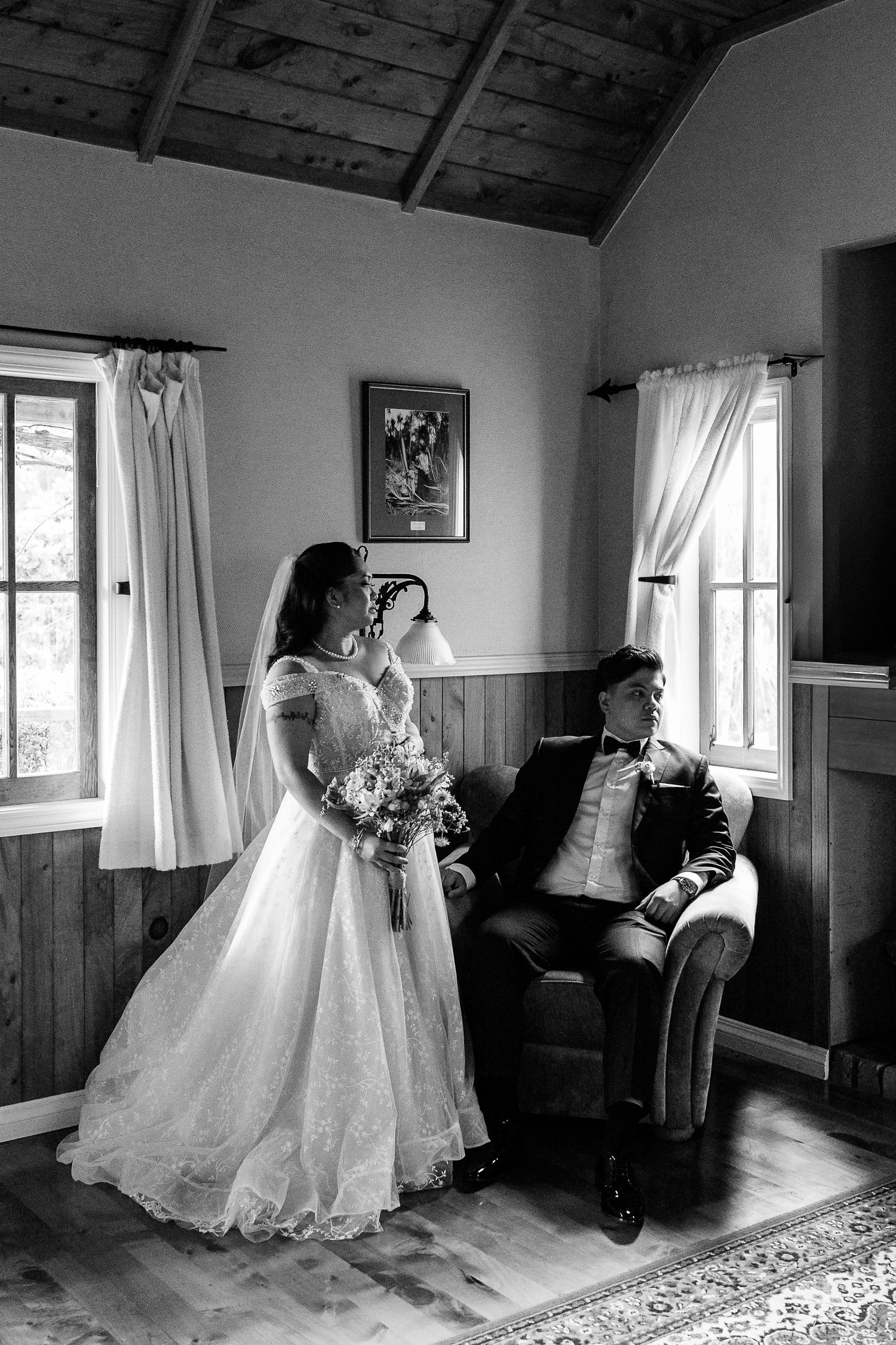 Black and white series of wedding preparation moments in rustic cabin setting.