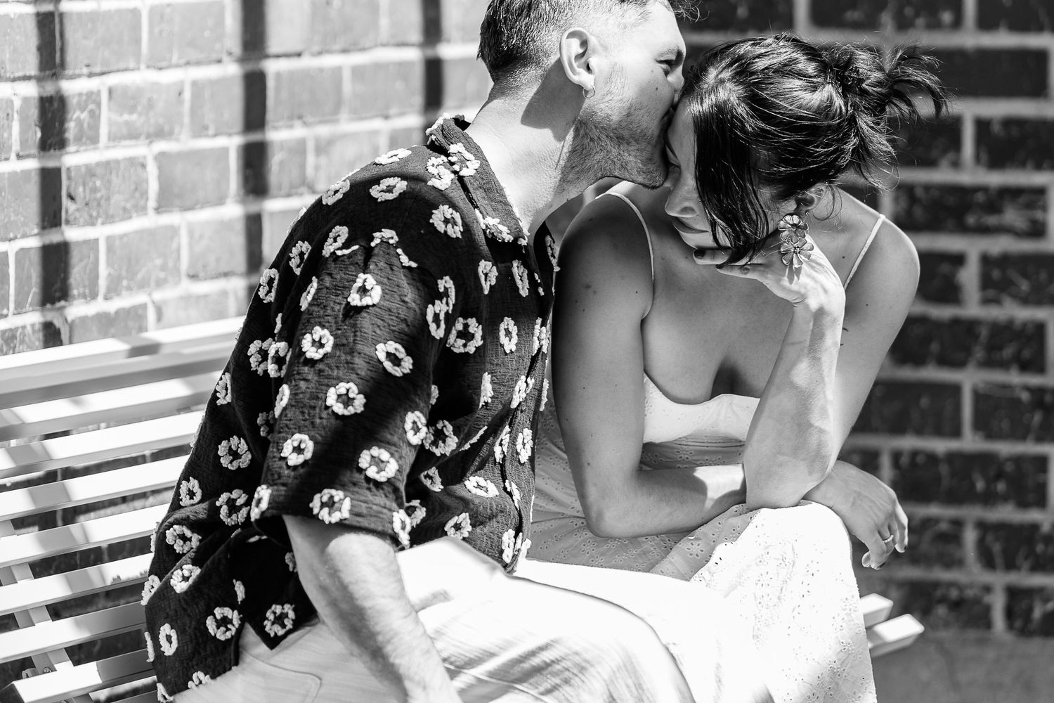 A romantic black and white photo sequence showing tender moments between a couple.