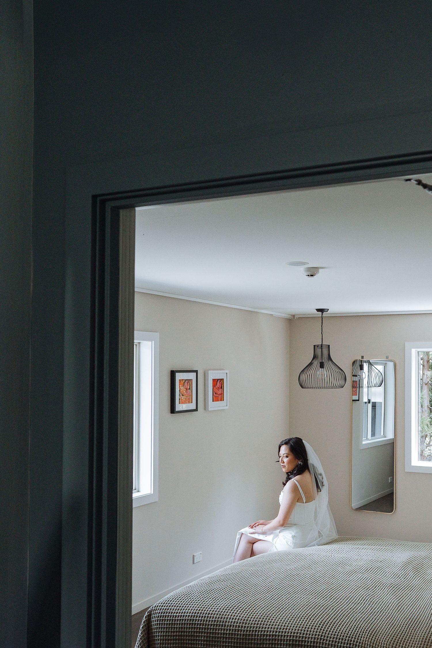 Artistic black and white photo series showing a bedroom interior with soft natural lighting through windows.