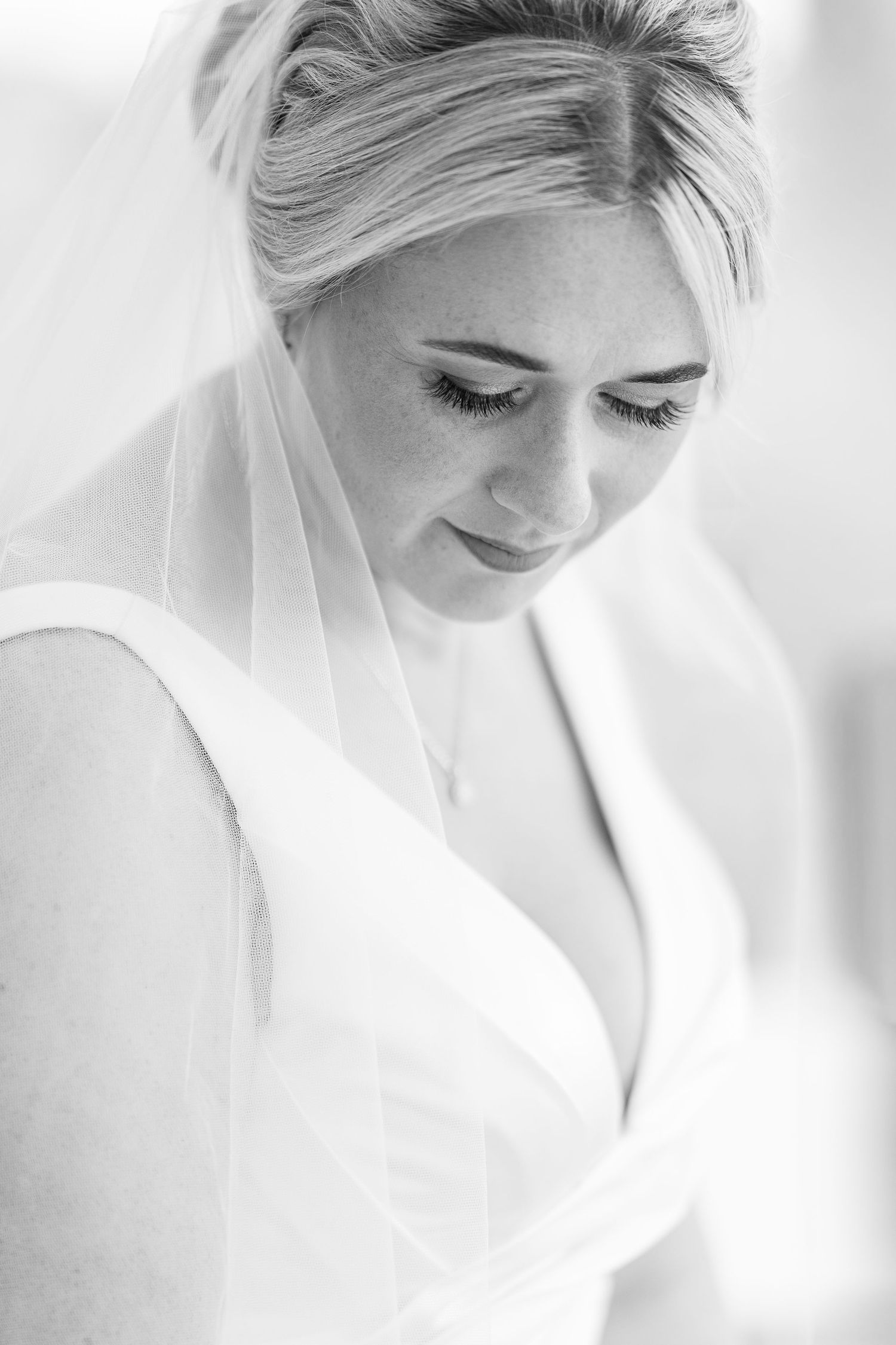 Intimate black and white bridal portrait showcasing elegant styling.