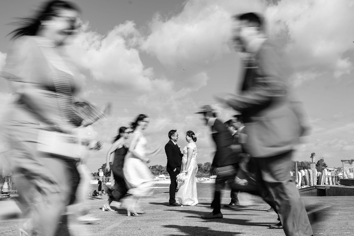 Motion blur photograph of people dancing at an outdoor celebration.