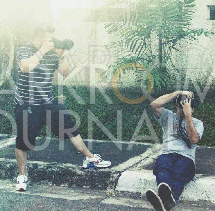 Photographers working in a tropical setting with text overlay.
