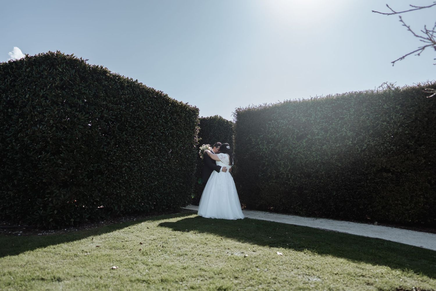 Elegant wedding ceremony setup on a manicured lawn with mountain views.