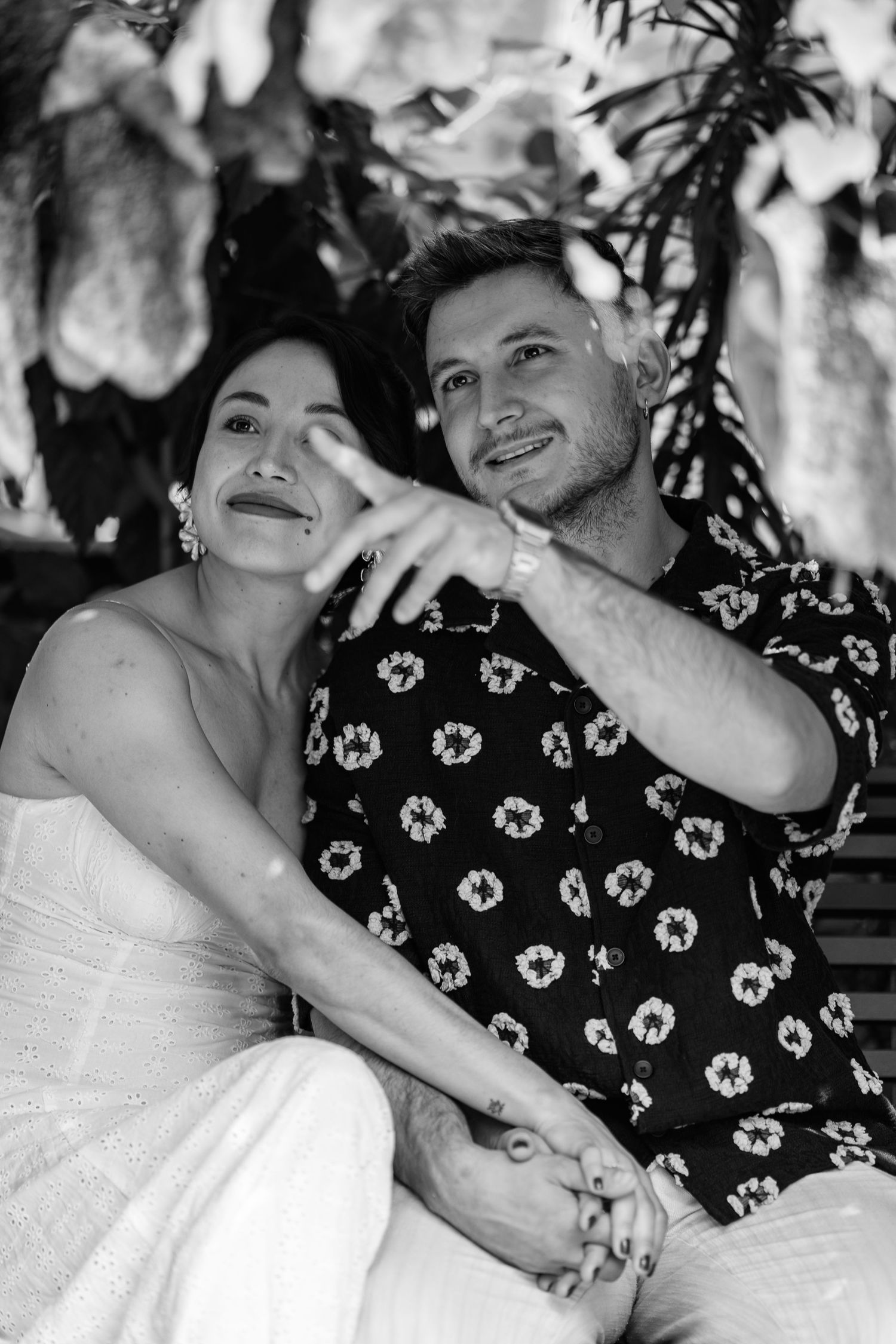 Series of black and white candid shots showing couple's playful interactions.