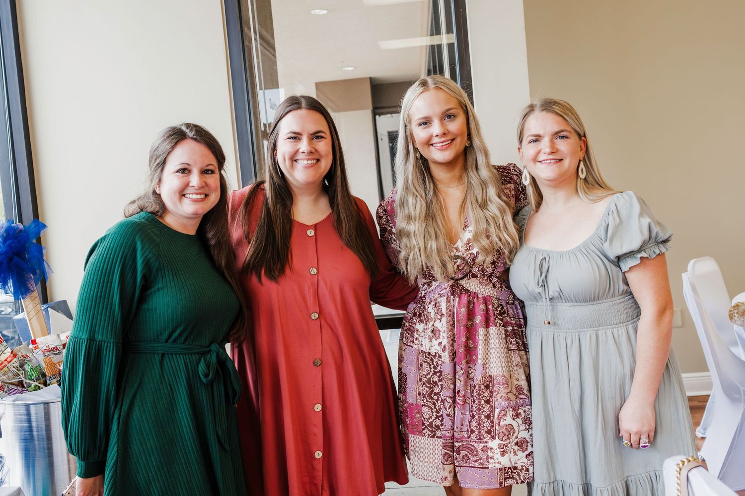 Group photo at a special occasion wearing coordinated dressy casual outfits.
