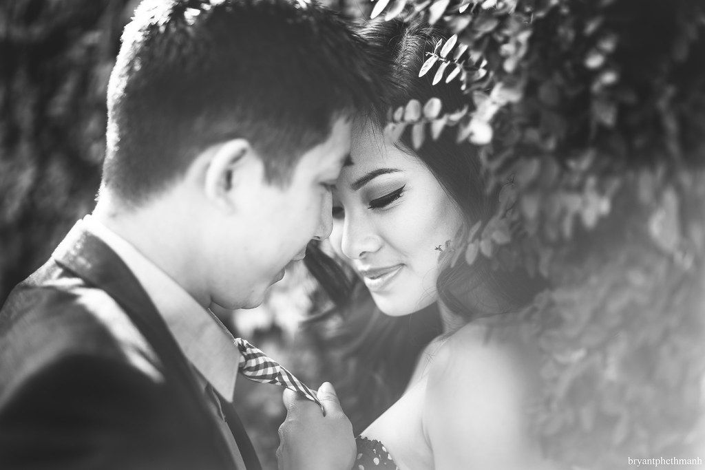 A romantic black and white wedding photo montage showing six intimate moments between couples.