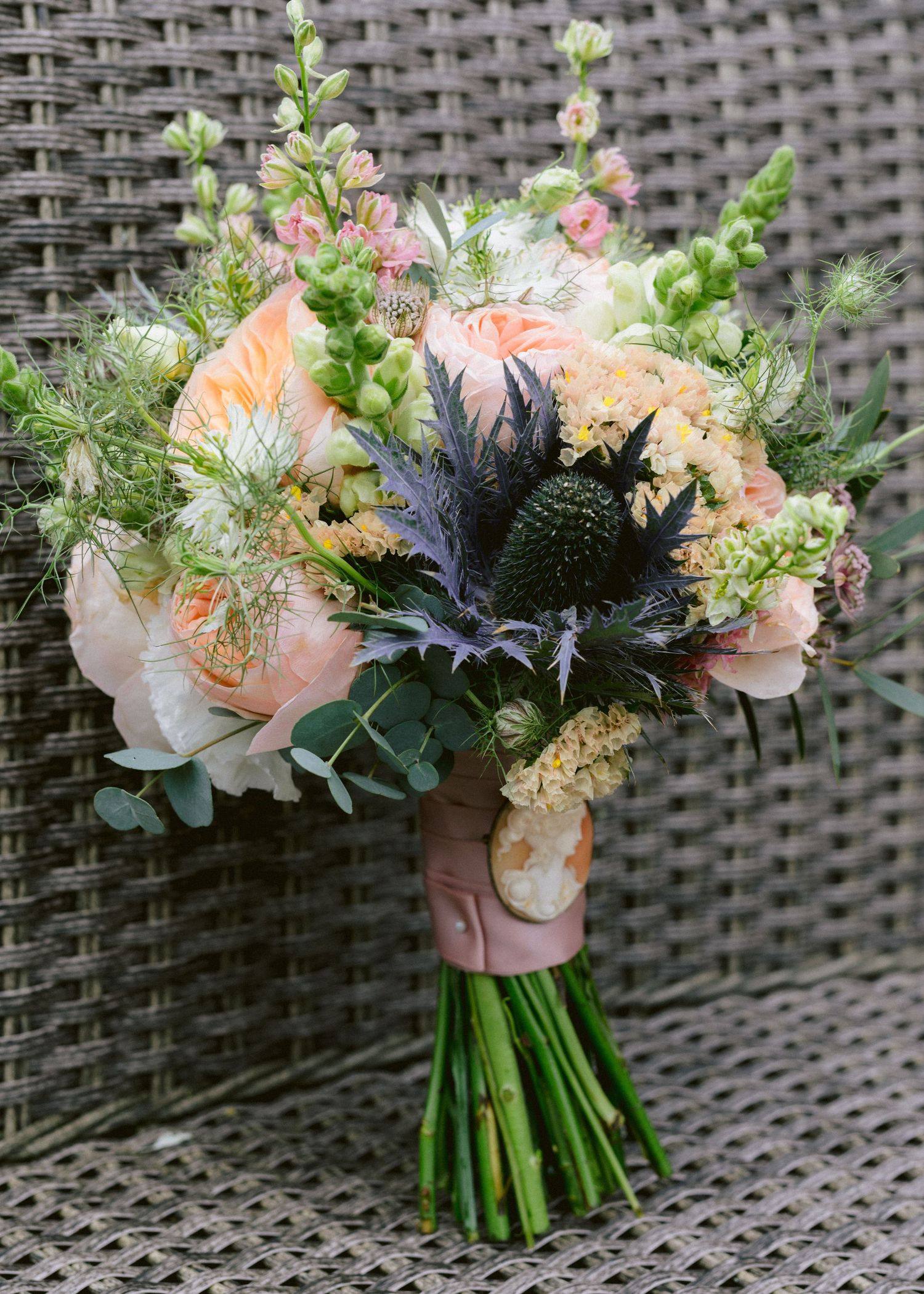 Close-up of bride’s bouquet with pastel roses and greenery at London wedding