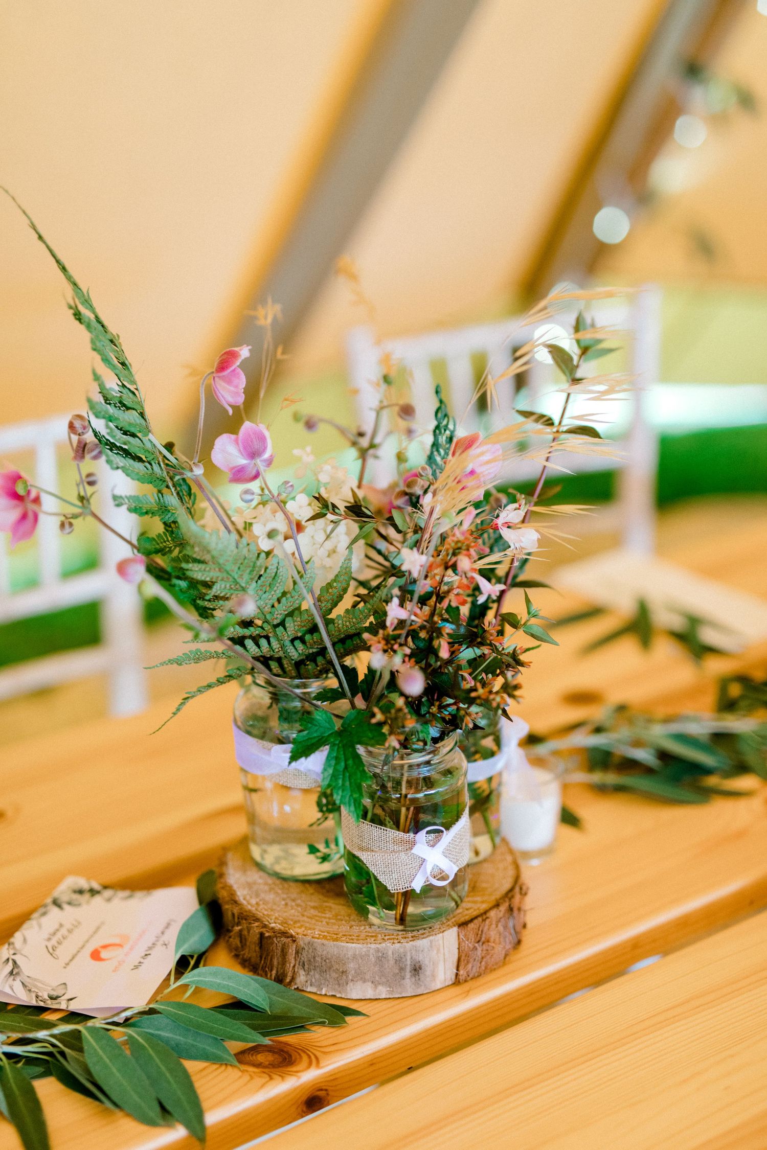 Centrepiece which is a bouquet of wildlflowers for wedding guests' table - detail shot in Hoath House, Kent wedding