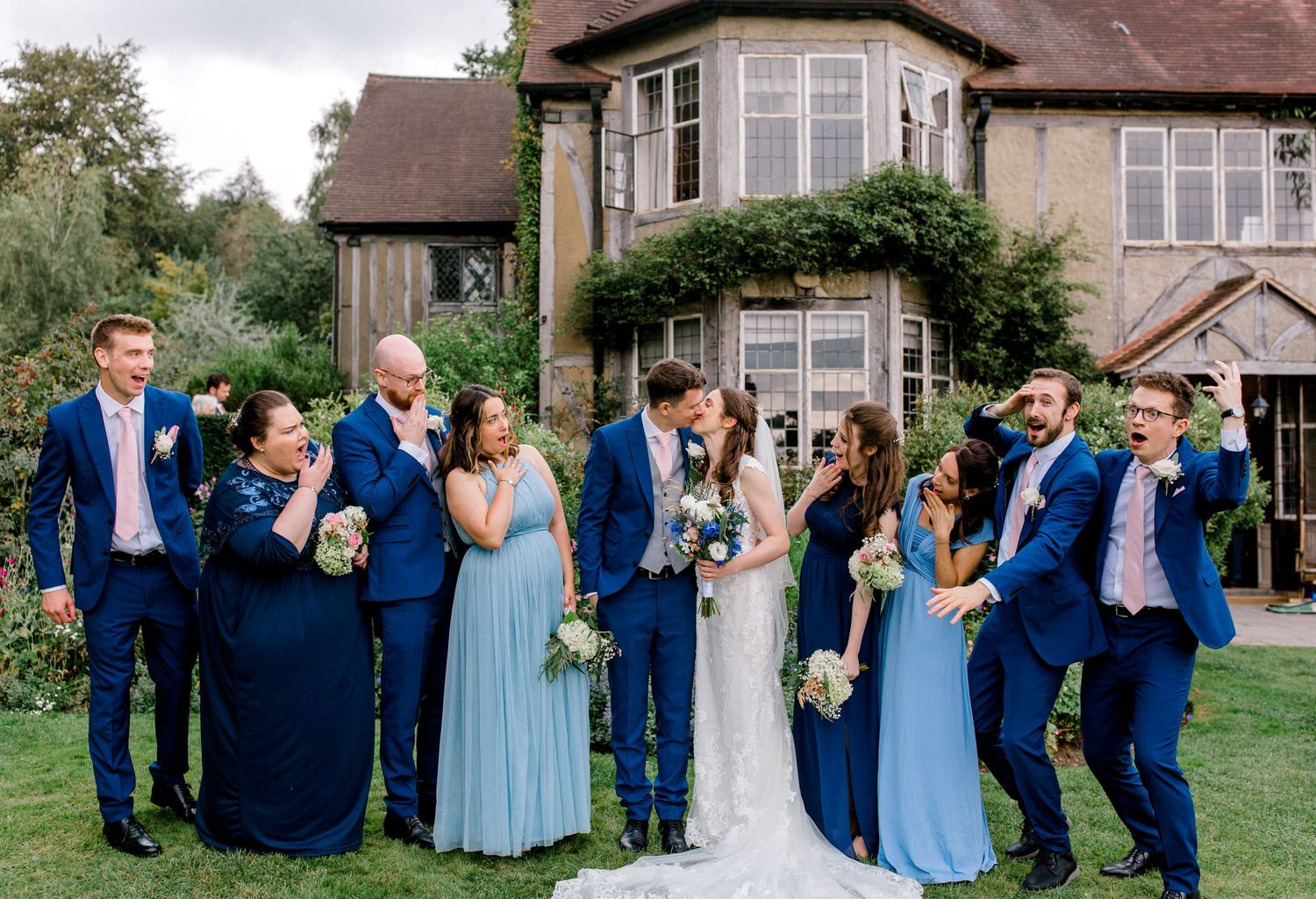 Funny group photo of couple with bridal party Hoath House Edenbridge Kent