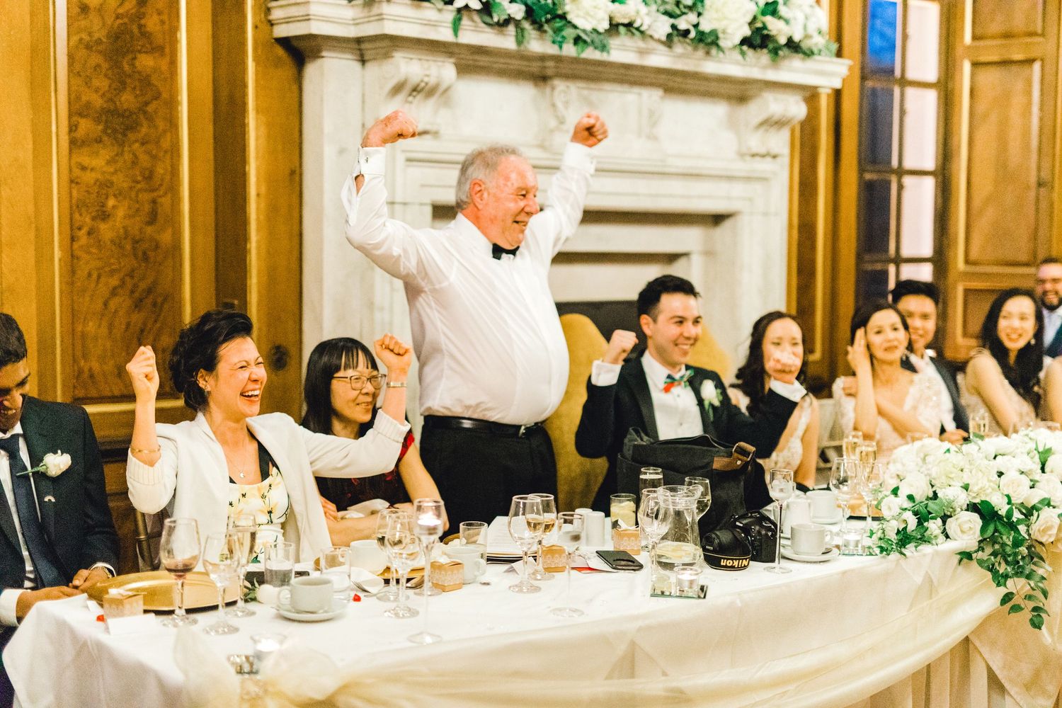 Father of the groom giving a funny wedding speech during reception – candid guest reactions Gosfield Hall Essex - candid wedding photography