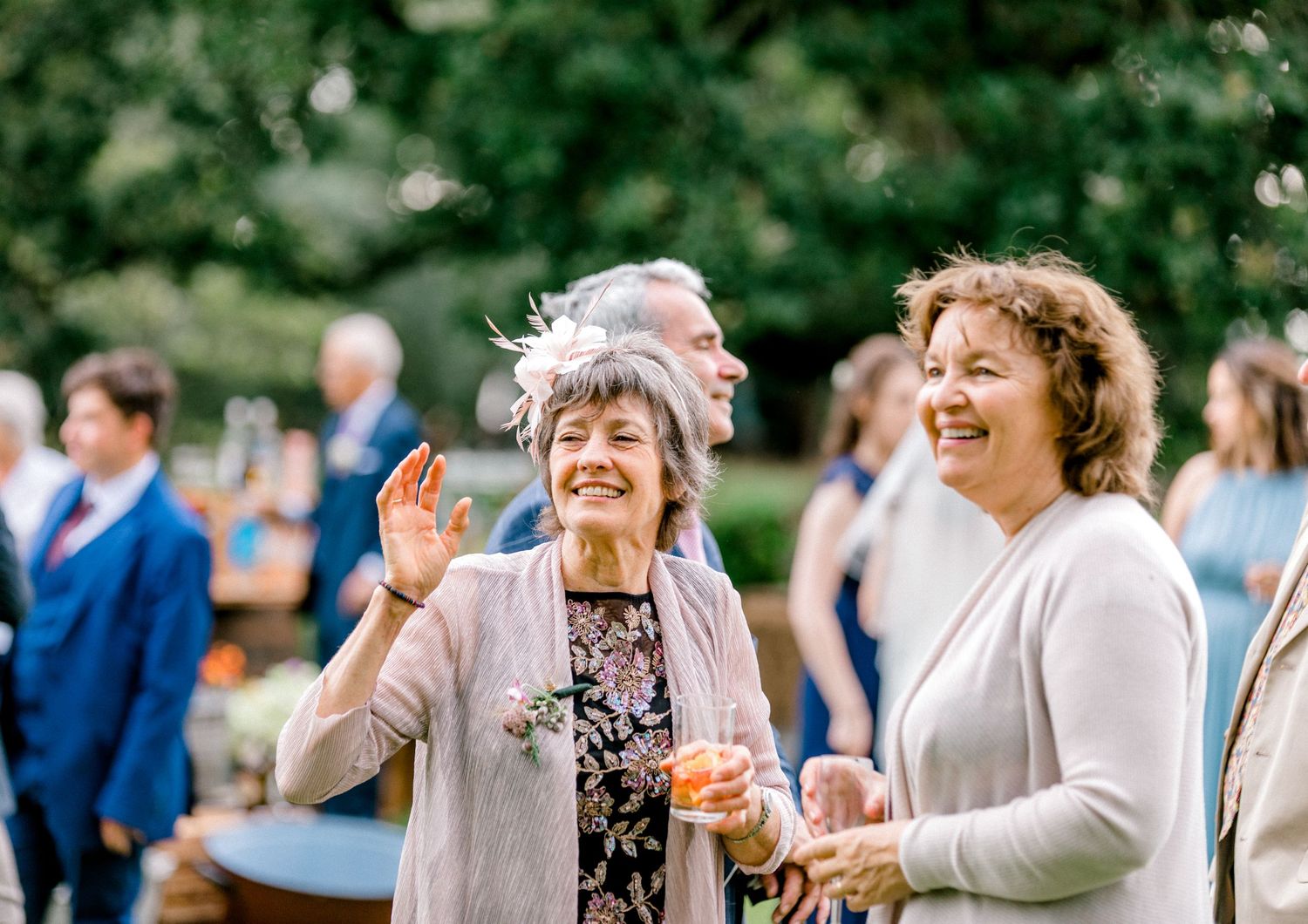 Candid photograph of guests during wedding reception - Hoath House, Kent