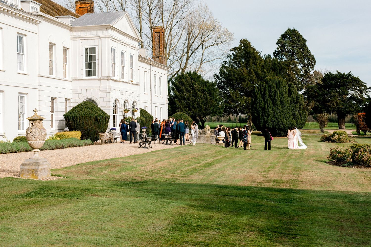 Wide angle wedding reception photography showing entire wedding party celebrating together in Essex