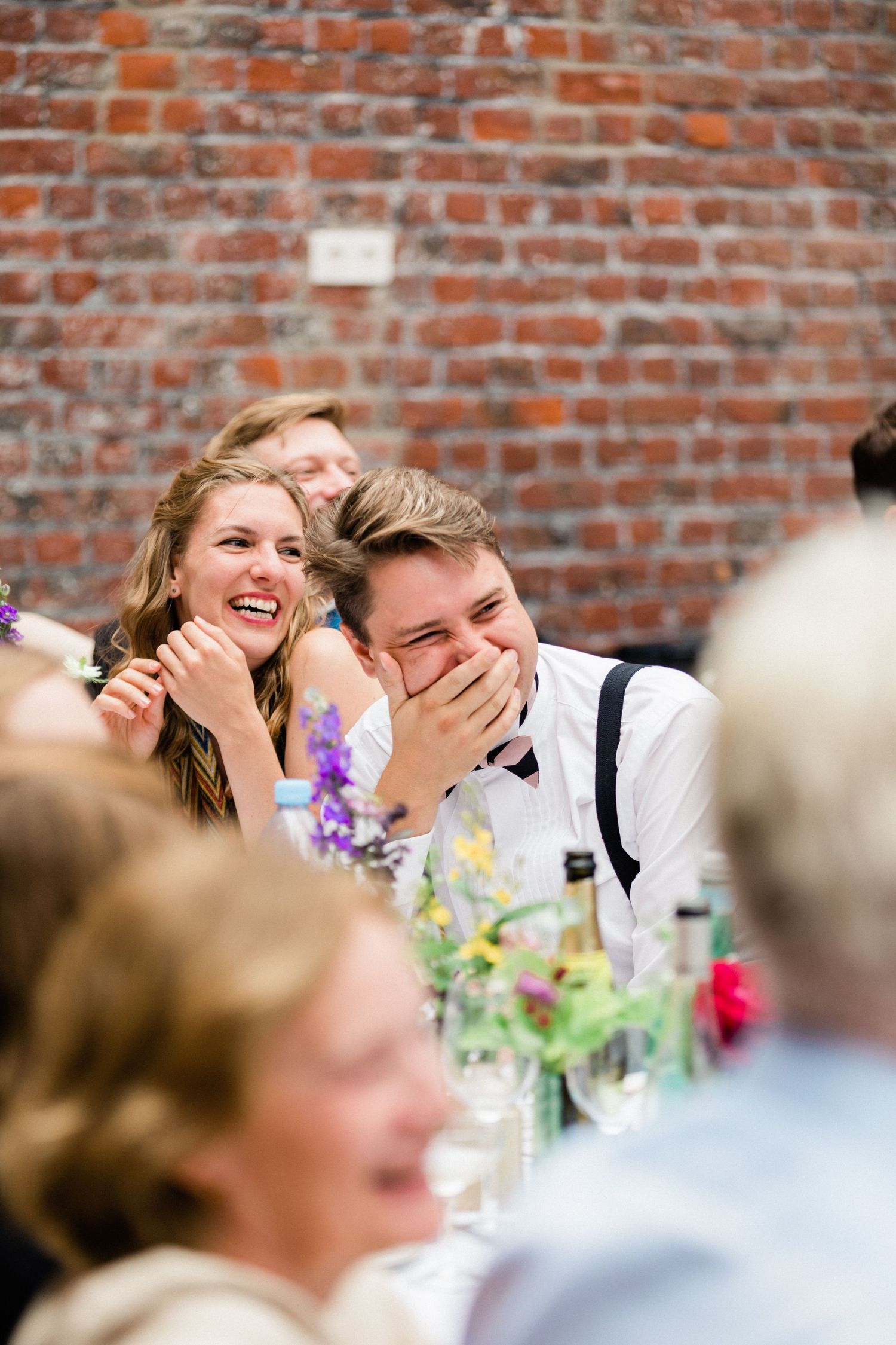 Guests reacting with joy to funny stories during best man’s speech Hallines France wedding