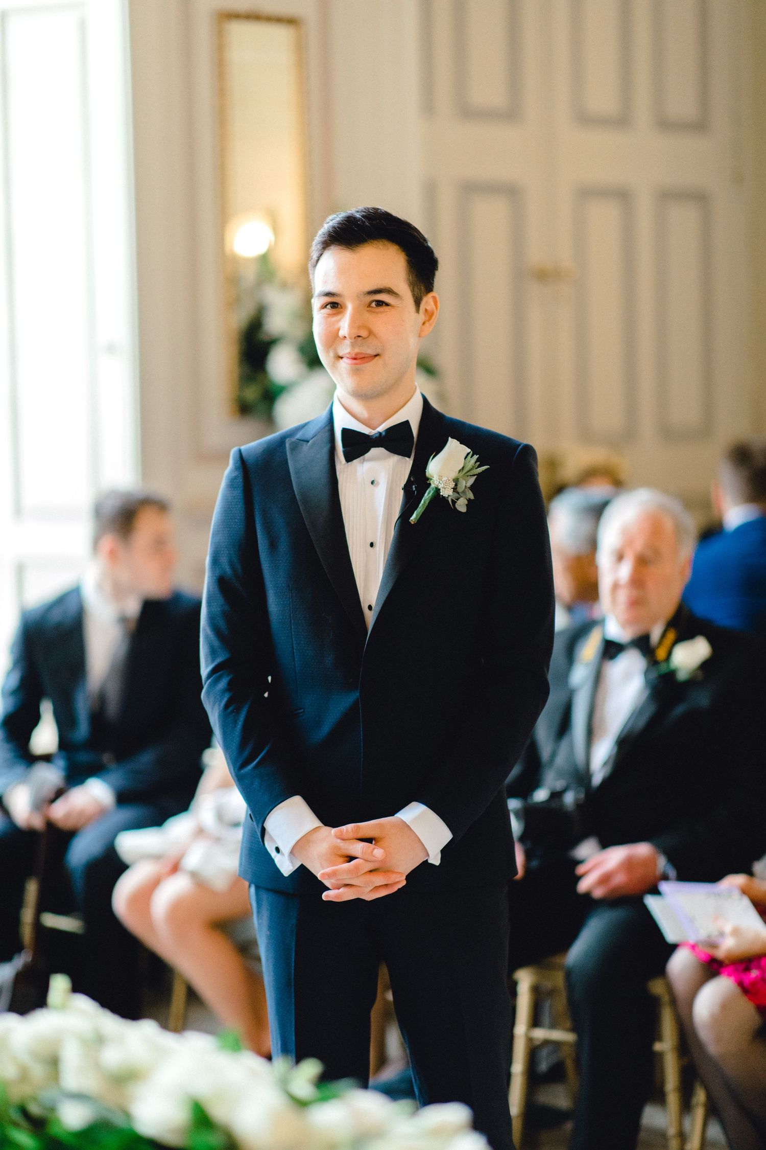 Groom at the altar waiting for bride at the beginning of ceremony Gosfield Hall Essex