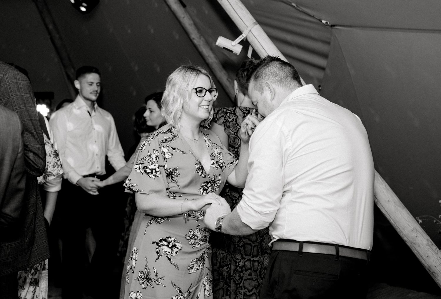 Couple dancing in wedding reception rustic reception in a marquee tent Hoath House Edenbridge Kent