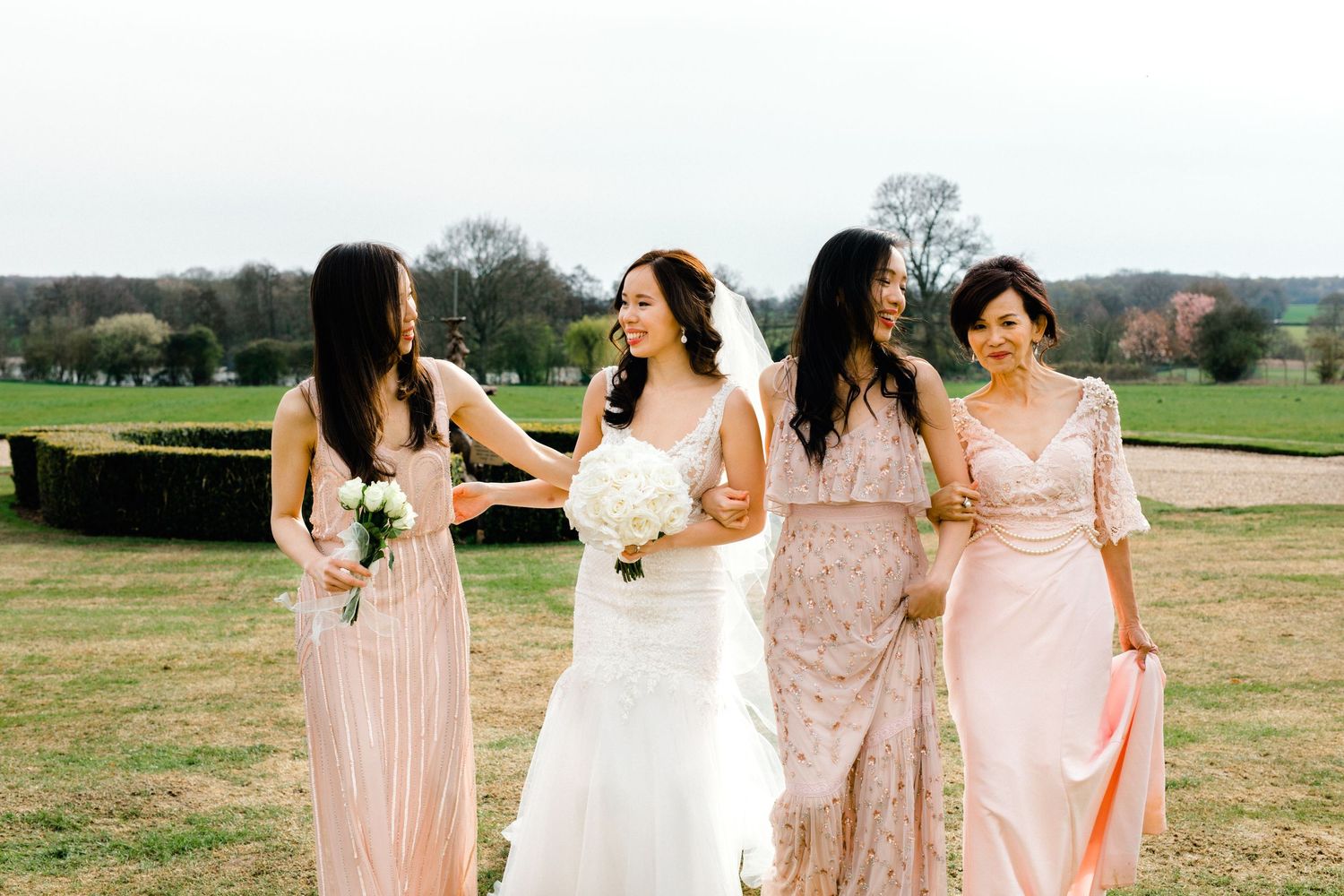 Candid group photo of bride and her bridal party and mum Gosfield Hall Essex
