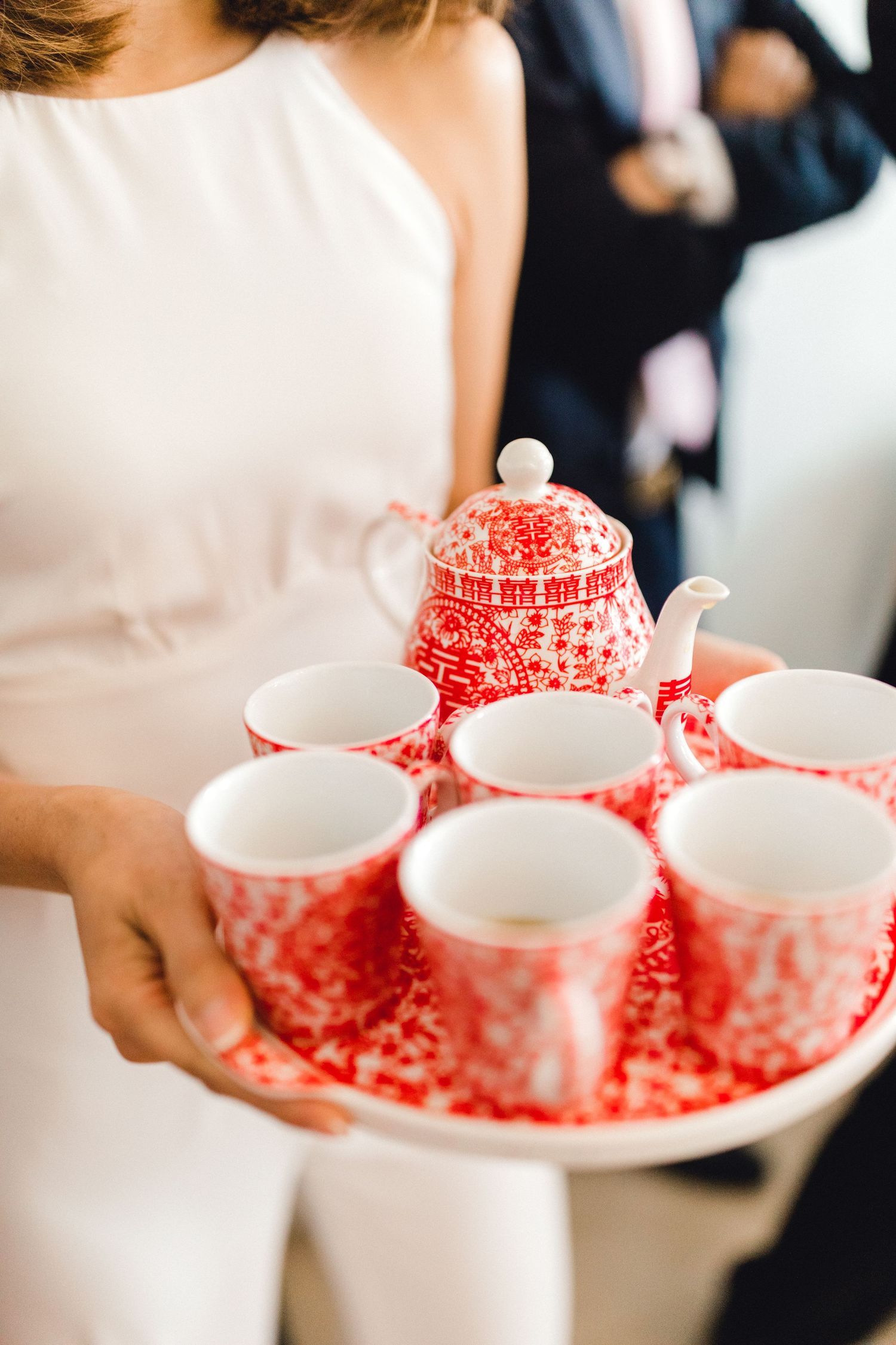 Chinese wedding photography showing tea being carried to the couple in Gosfield Essex