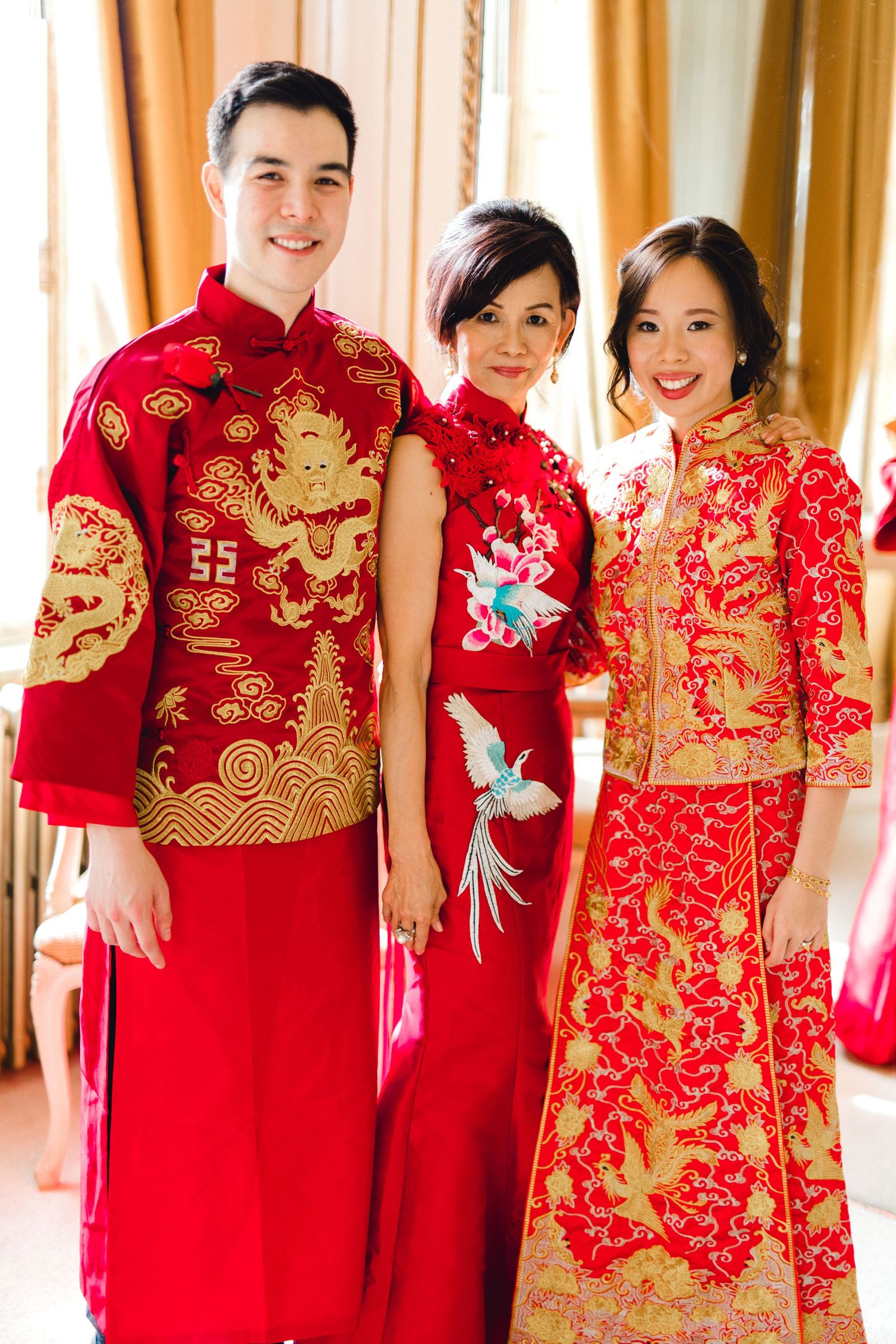 Bride and groom with mother Gosfield Hall Essex after a tea ceremony