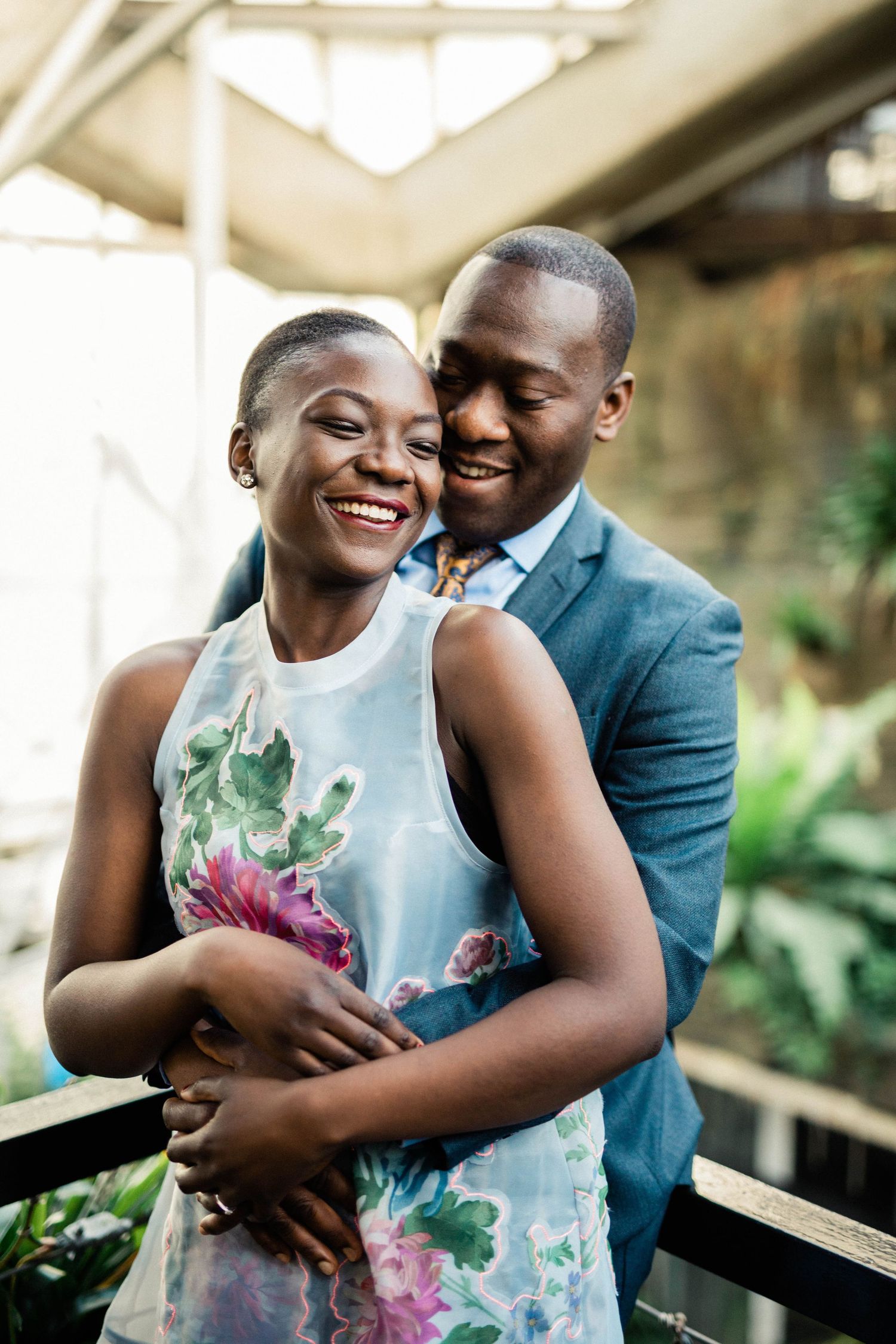 Intimate engagement portrait of couple sharing tender moment in natural lighting in London