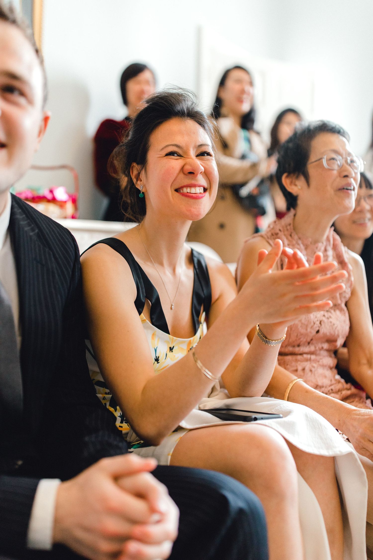 Guests enjoying the tea ceremony games in Gosfield Hall Essex - candid wedding photography