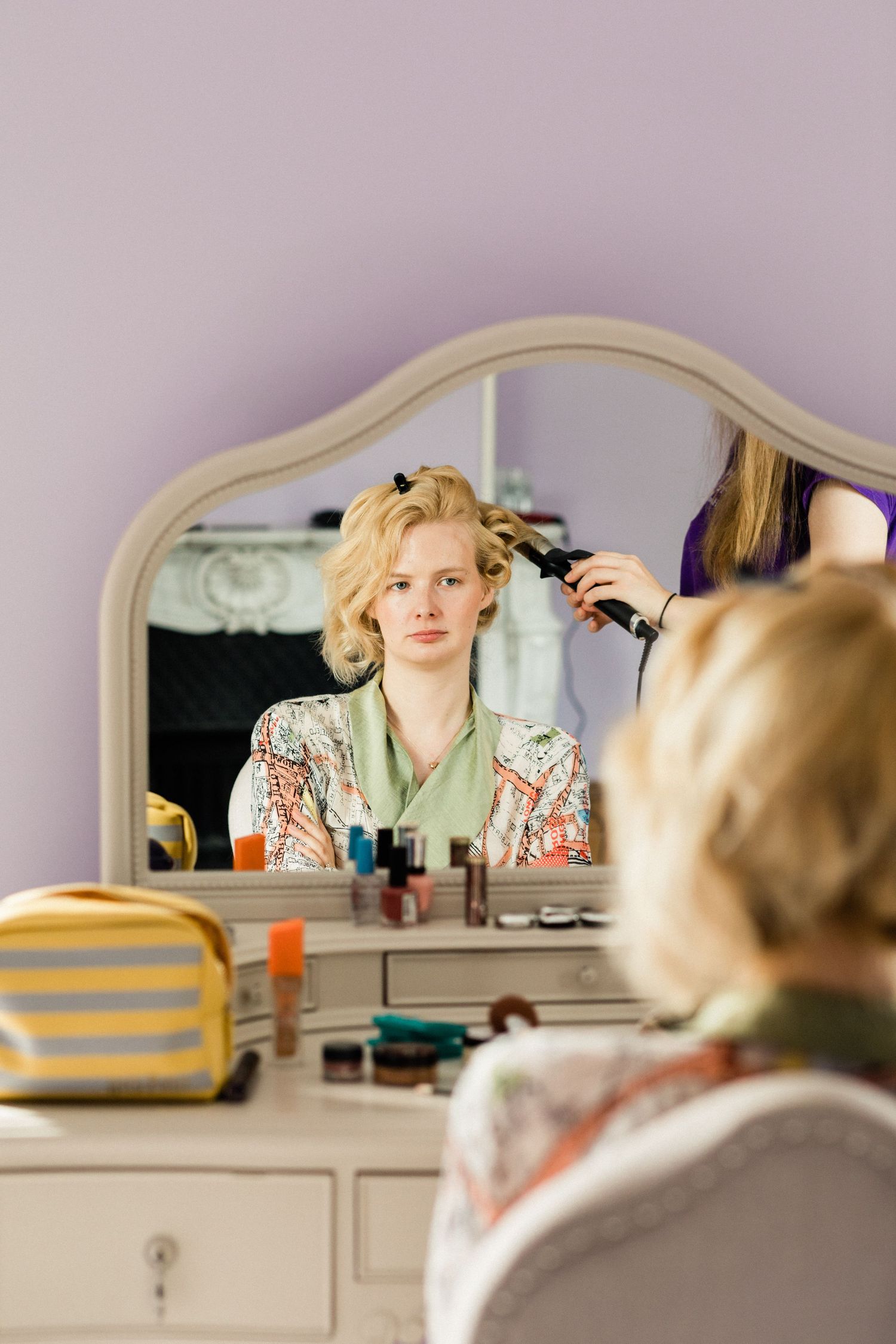 Bridal getting ready photography capturing bride's wedding hair styling process