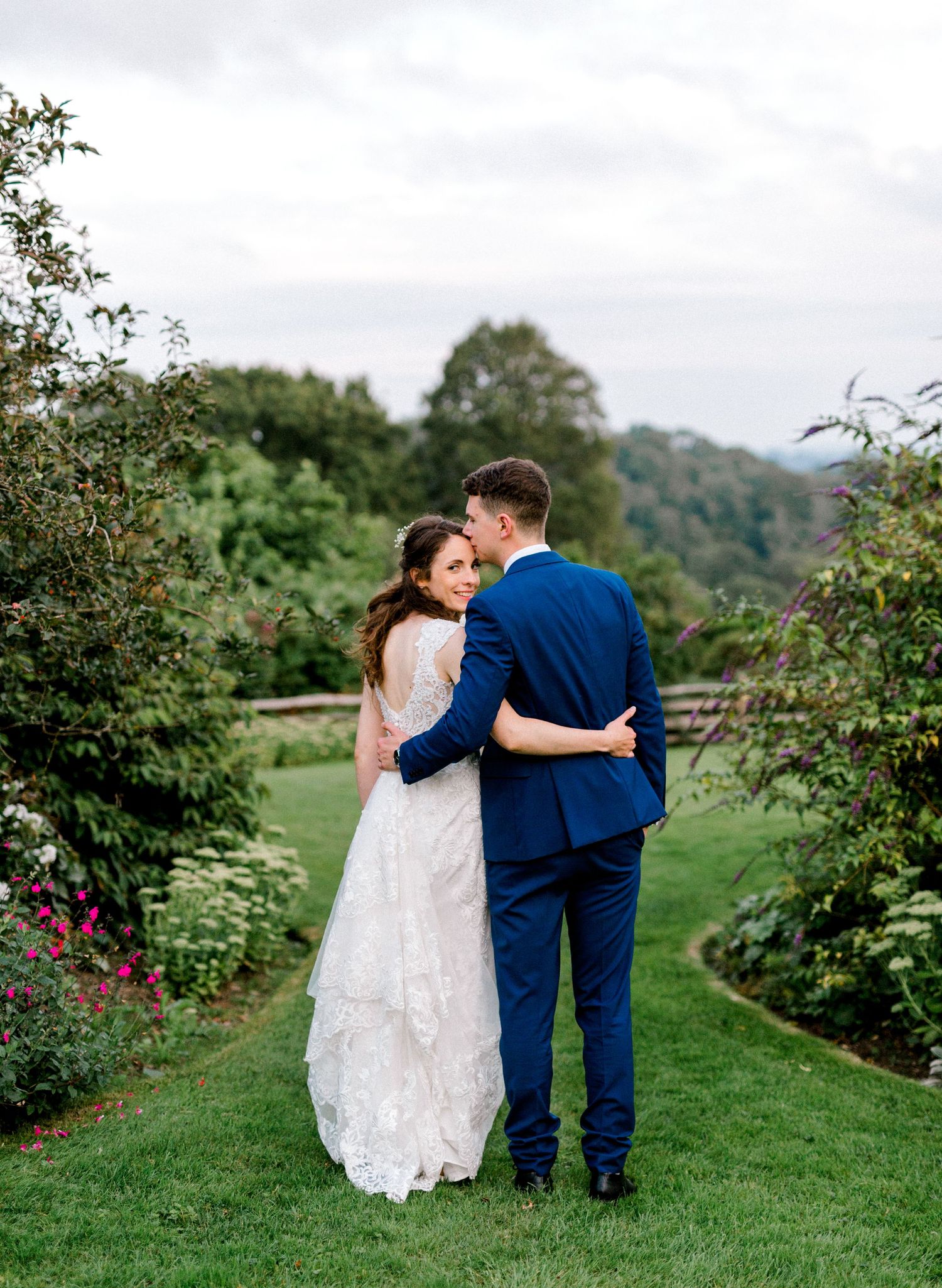 Bride and groom having quiet moment in reception holding hands during golden hour Hoath House Edenbridge