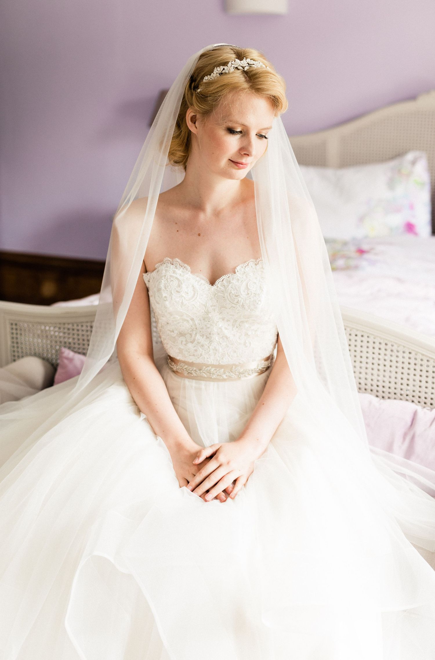 Romantic bride portrait with soft window light before ceremony begins