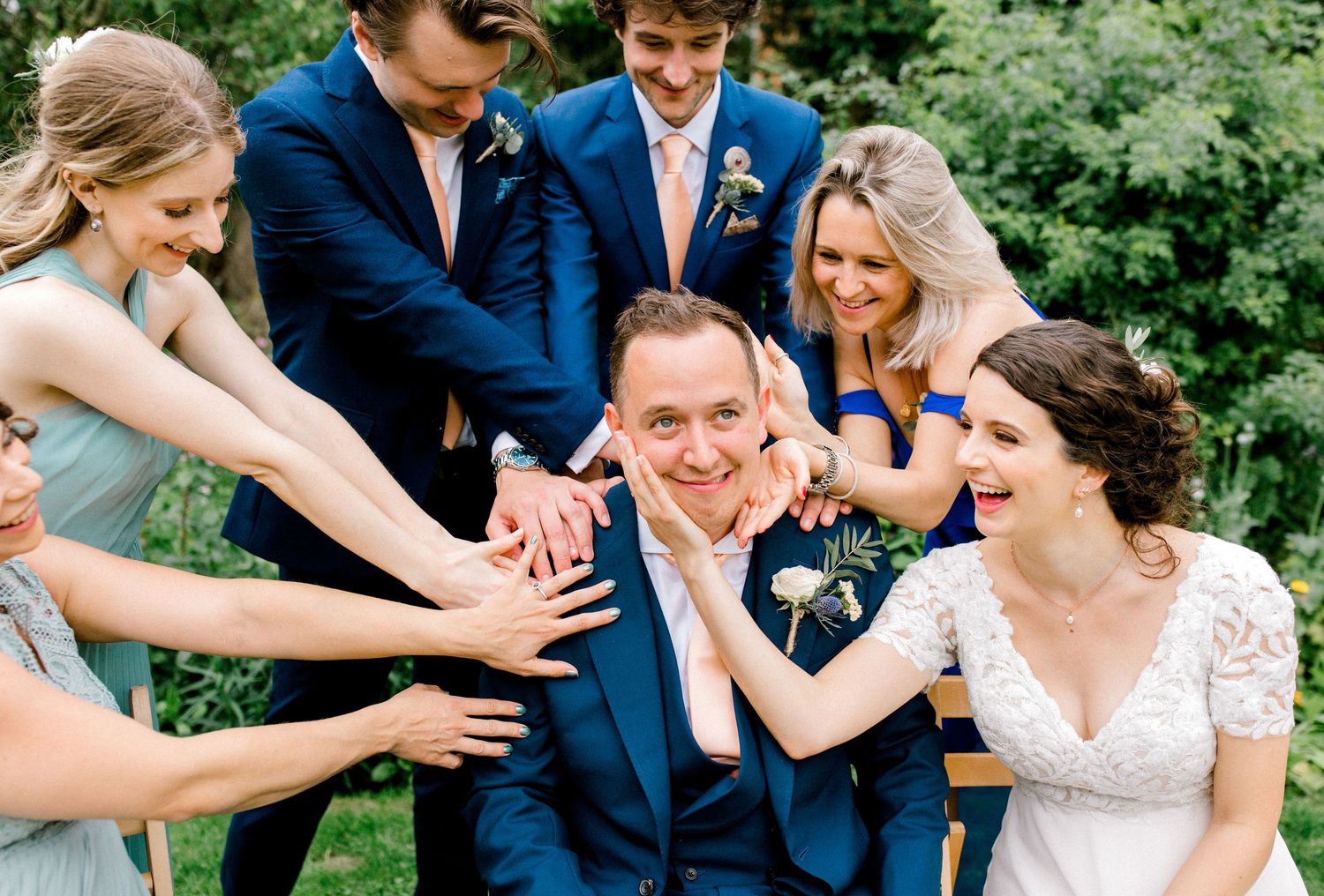 Wedding party pulling funny faces during portraits at a London wedding