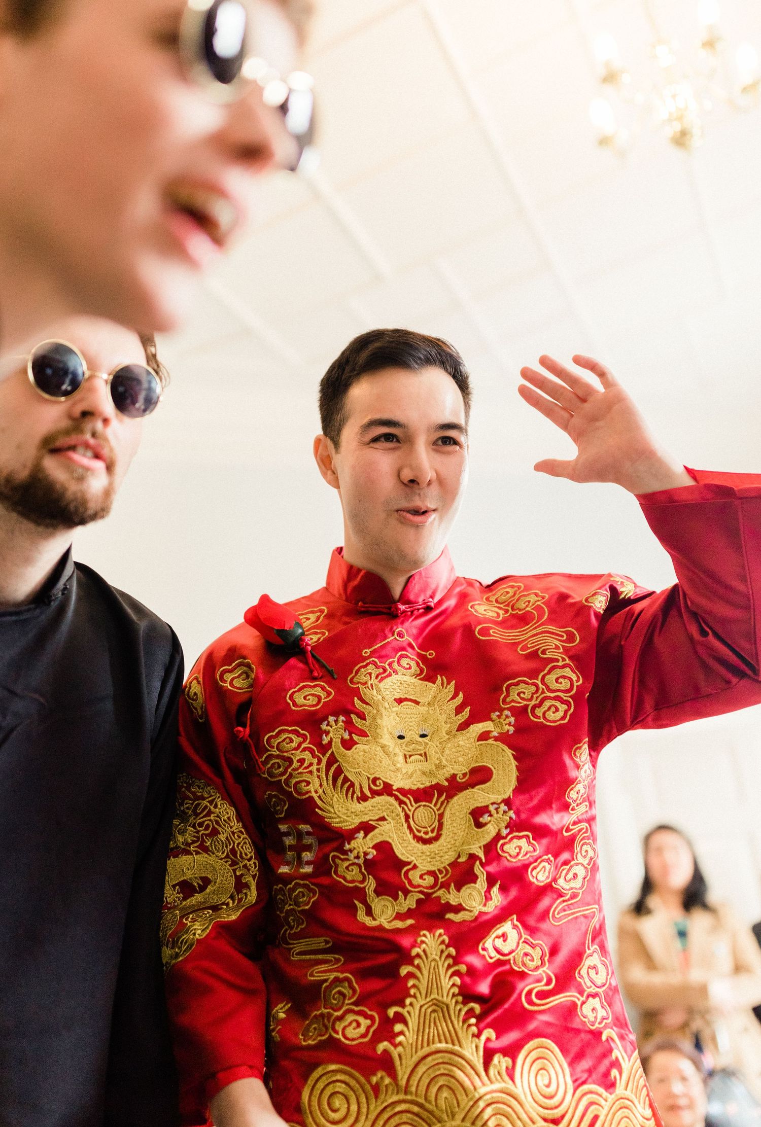 Groom in fun tea ceremony games Gosfield Hall Essex - candid wedding photography