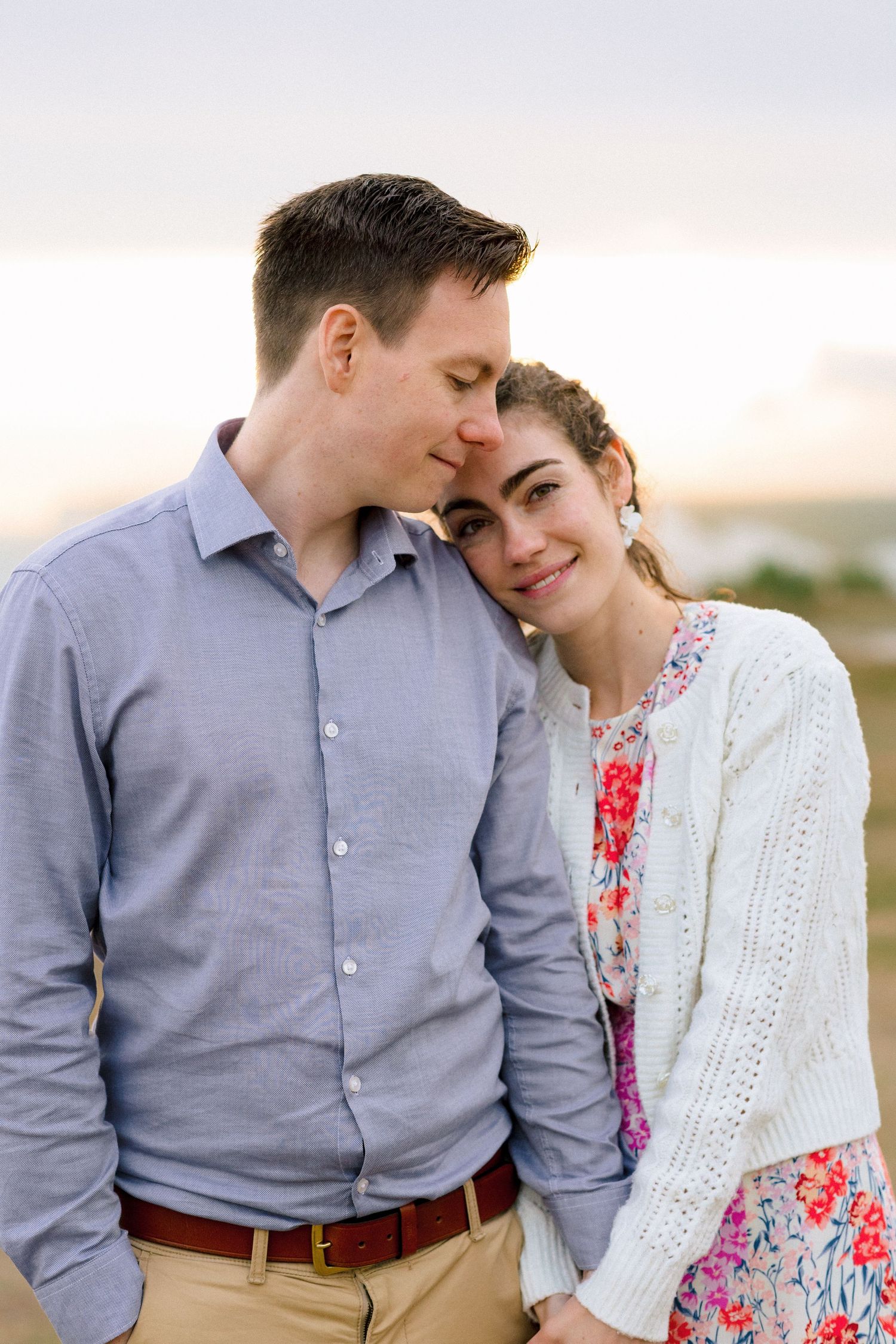 Engaged couple sharing intimate moment during professional engagement photography session in Kent