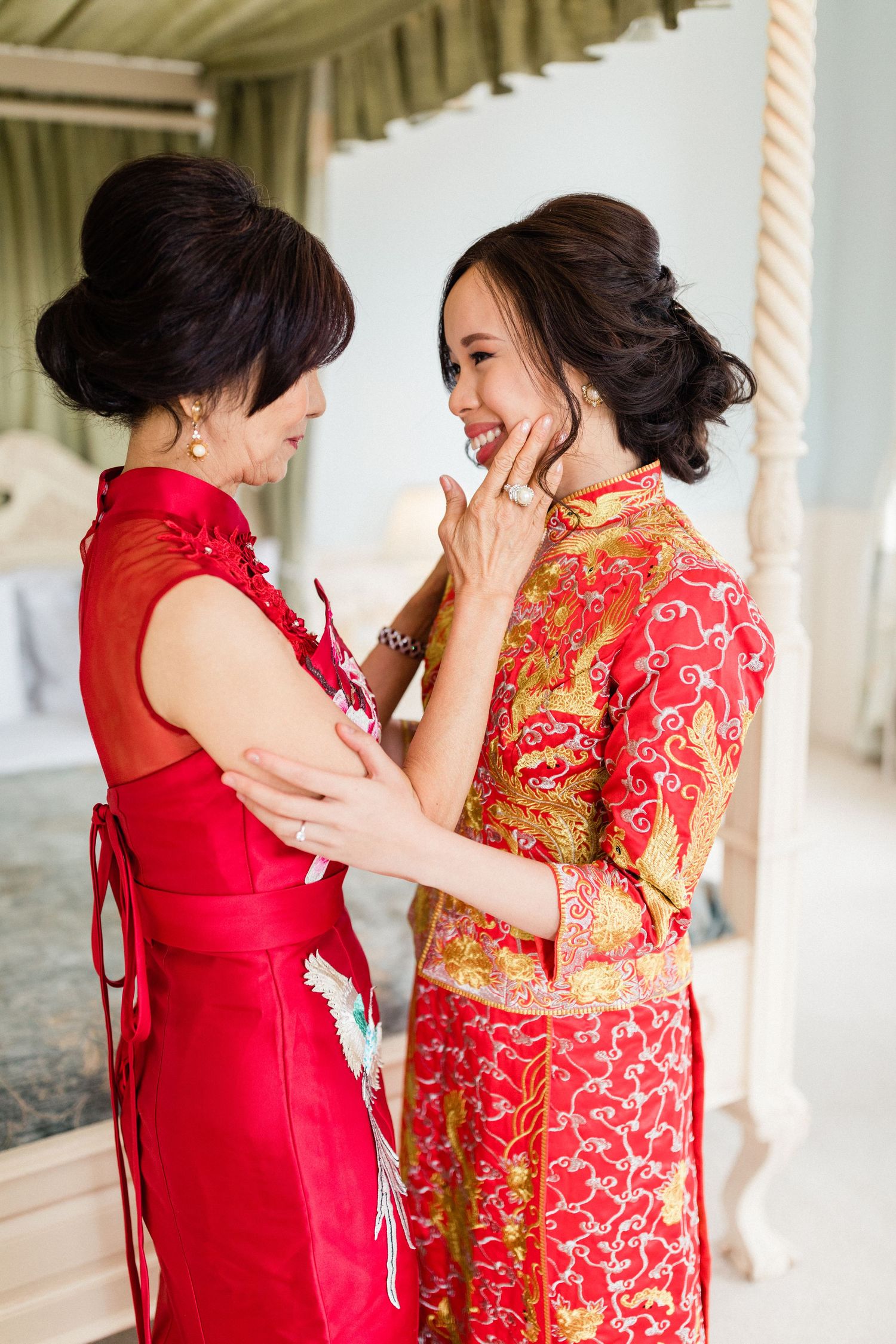 Tearful first look between bride and her mother – heartfelt moment before the tea ceremony Gosfield Hall Essex - candid wedding photography