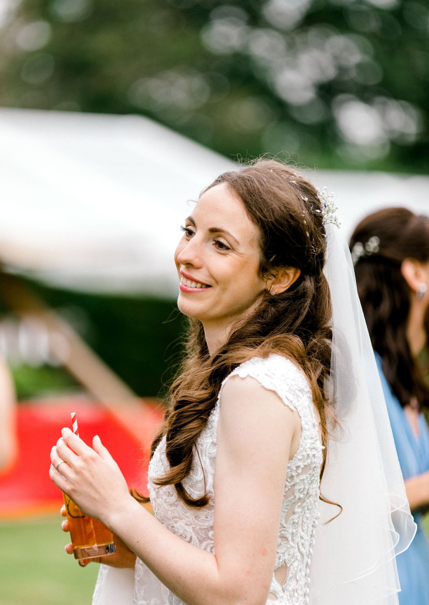 Candid photograph of the bride during wedding reception - Hoath House, Kent