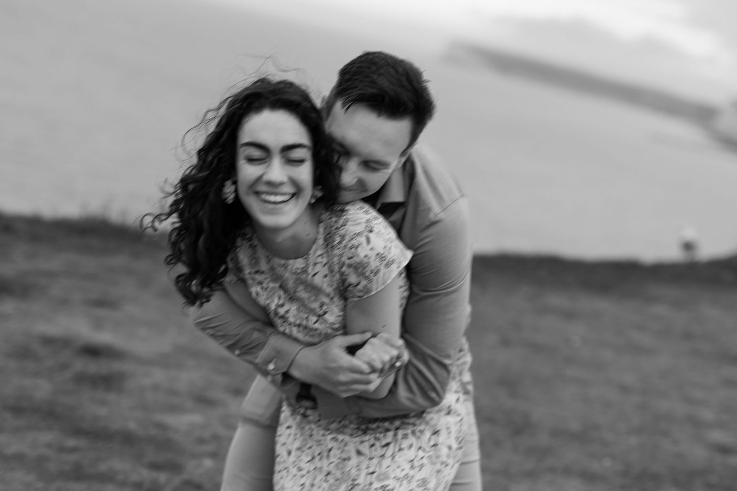 Candid engagement photos showing couple's fun-loving relationship and genuine laughter in Kent